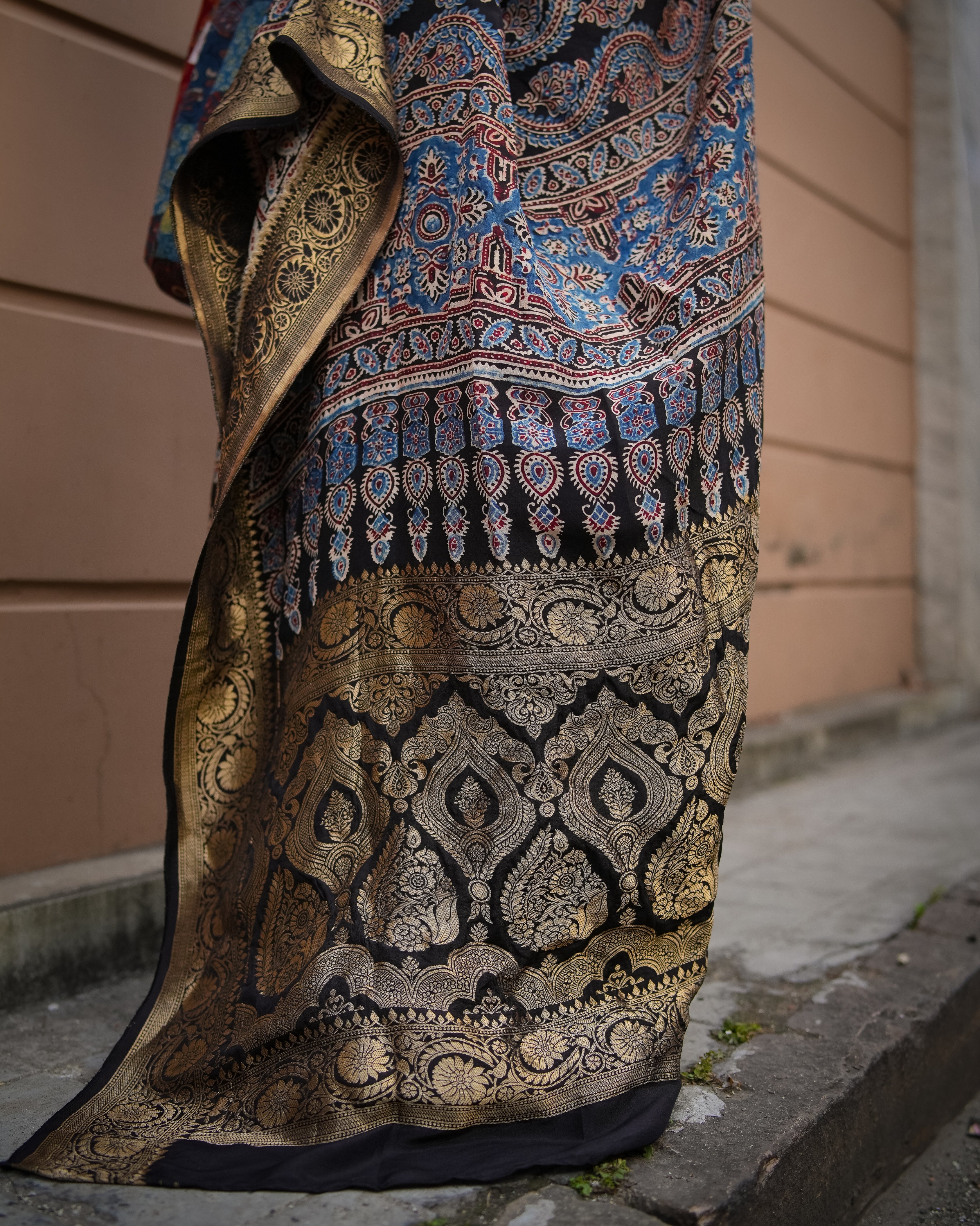 Kawaii ajrakh saree with intricate gold and blue traditional patterns draped gracefully