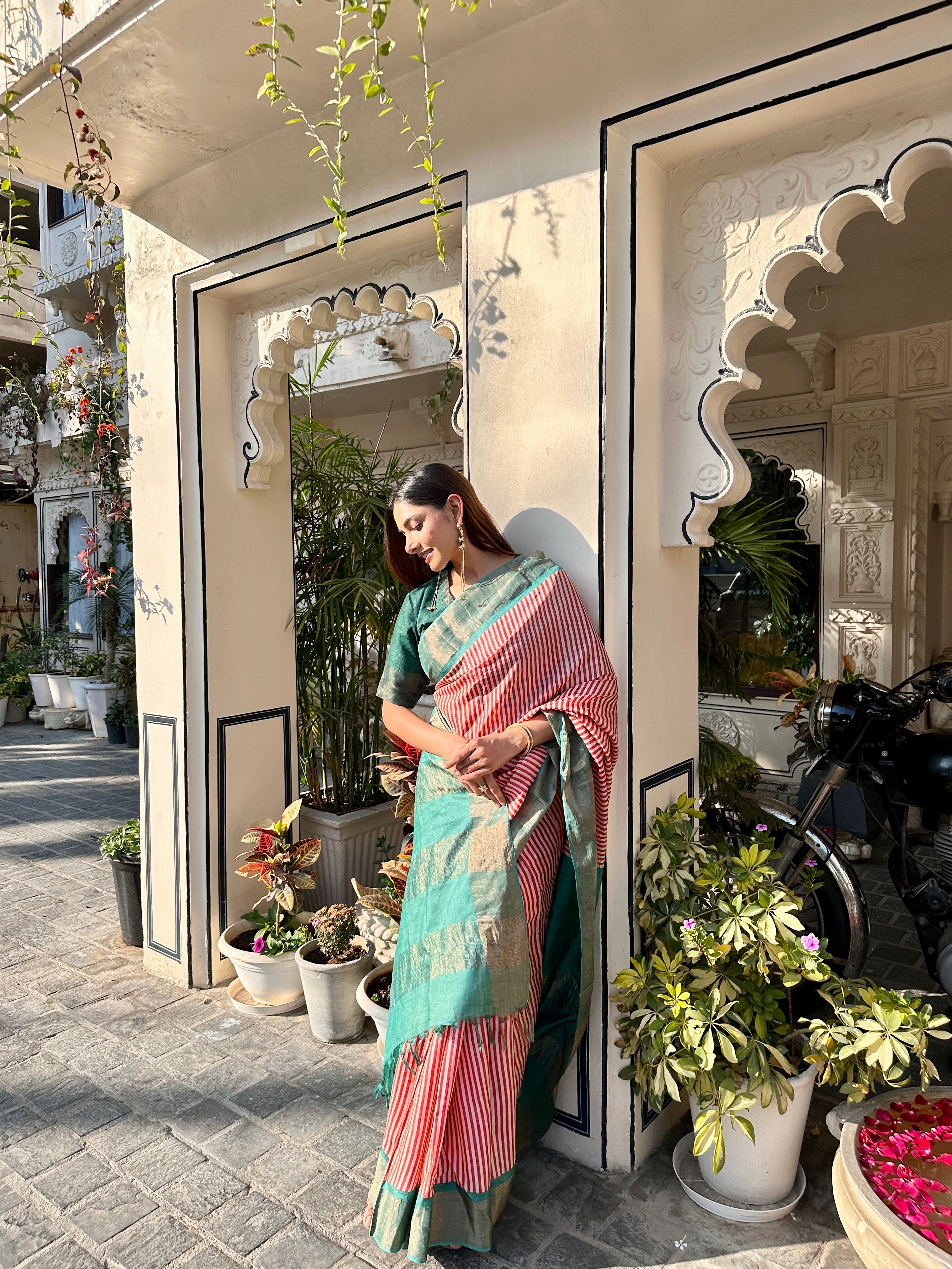 Elegant green and red block print saree with intricate stripes, perfect for festive occasions