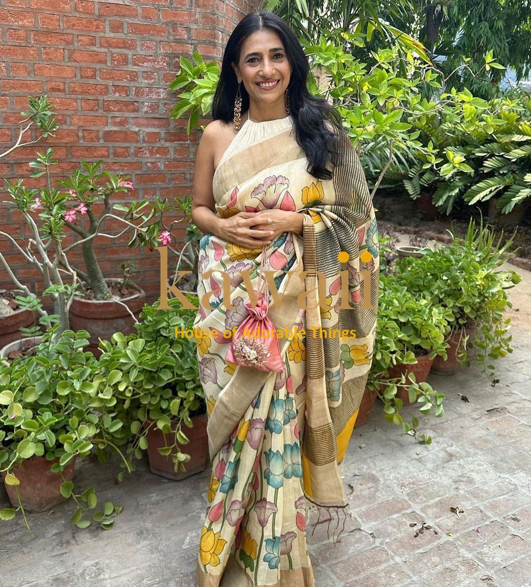 Kalamkari saree in beige with floral motifs, crafted from lightweight fabric, perfect for festive occasions