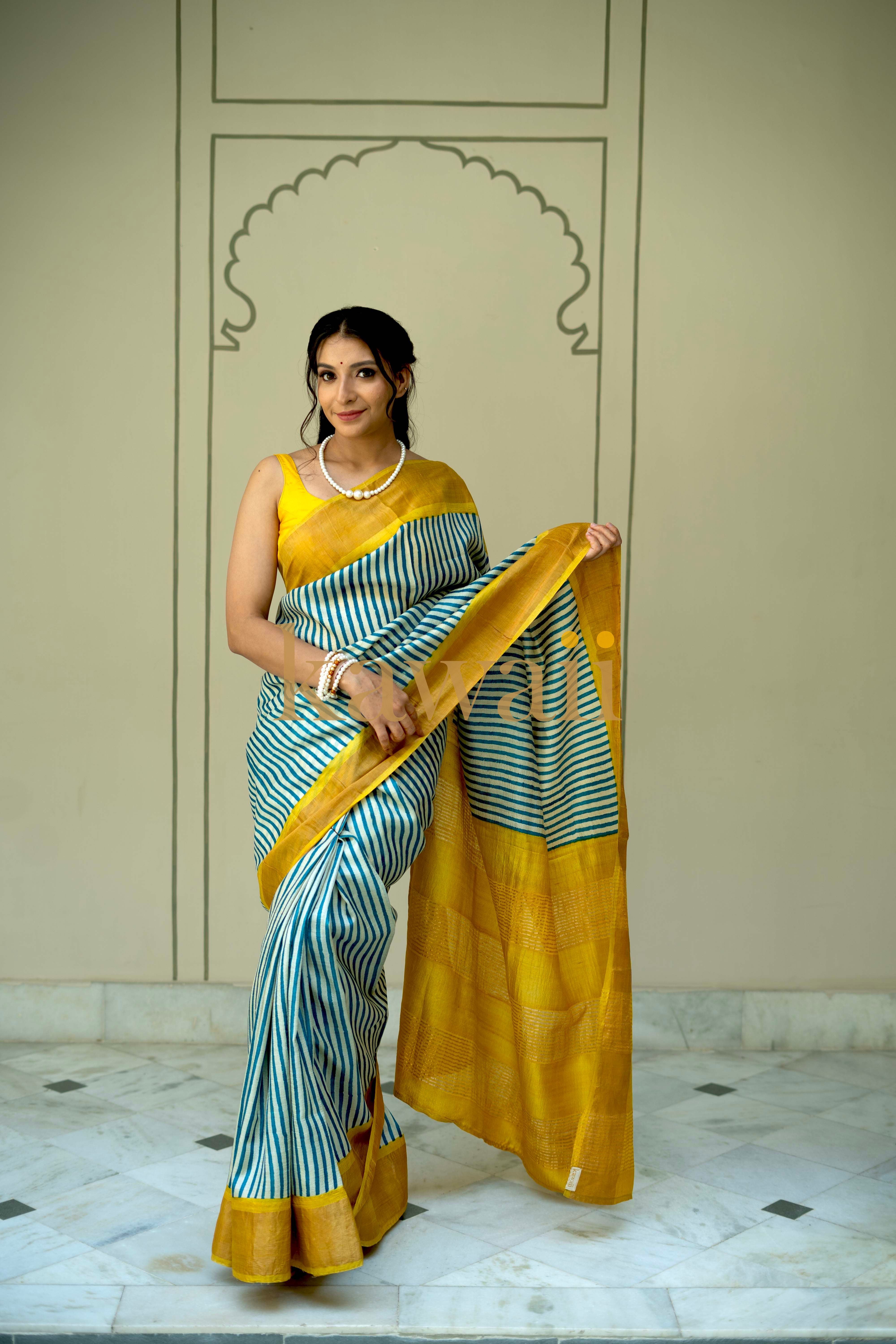 Kawaii tussar silk saree in blue and yellow stripes with elegant block print and a radiant drape