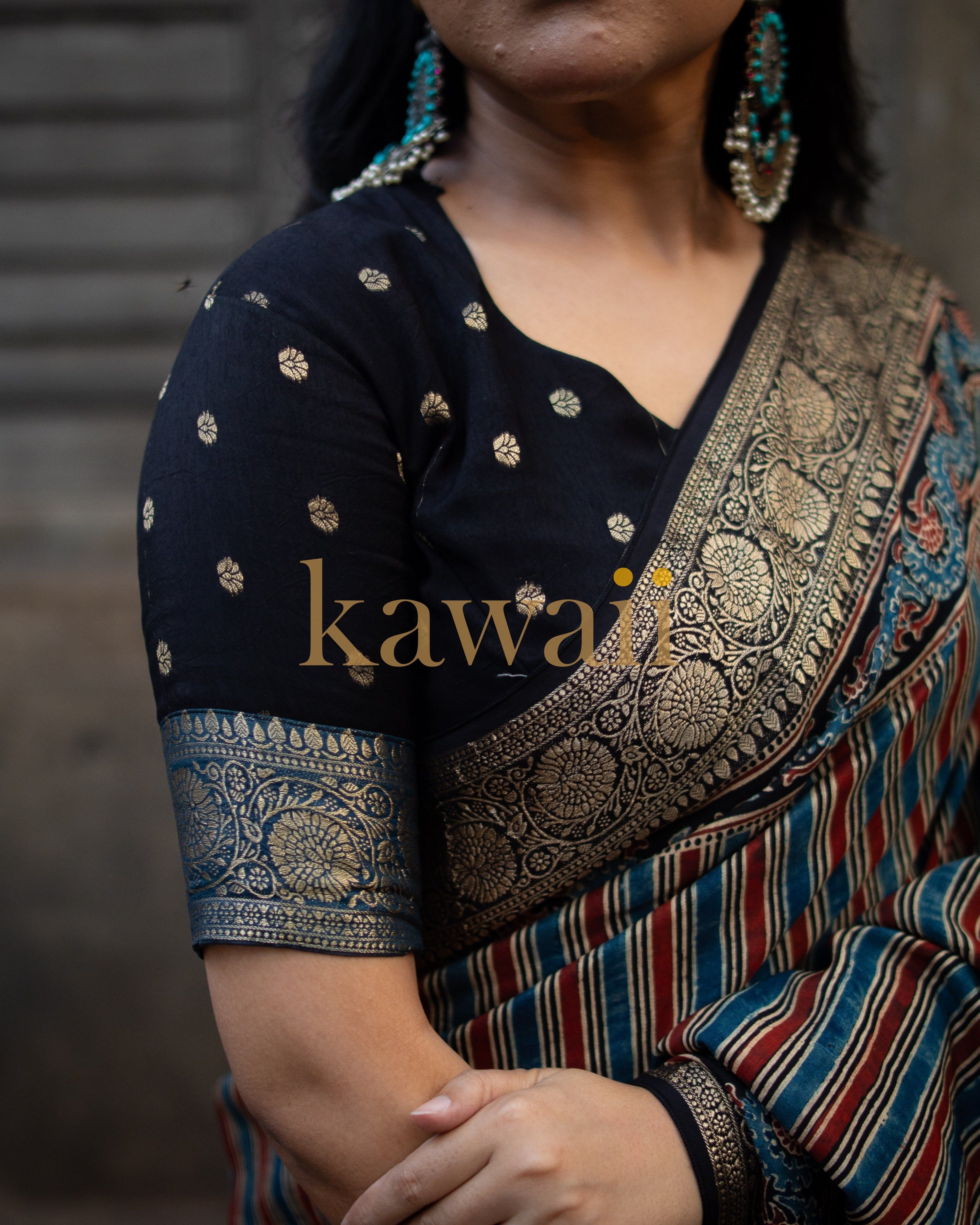 Kawaii ajrakh saree with intricate gold and blue patterns on black fabric draped on woman
