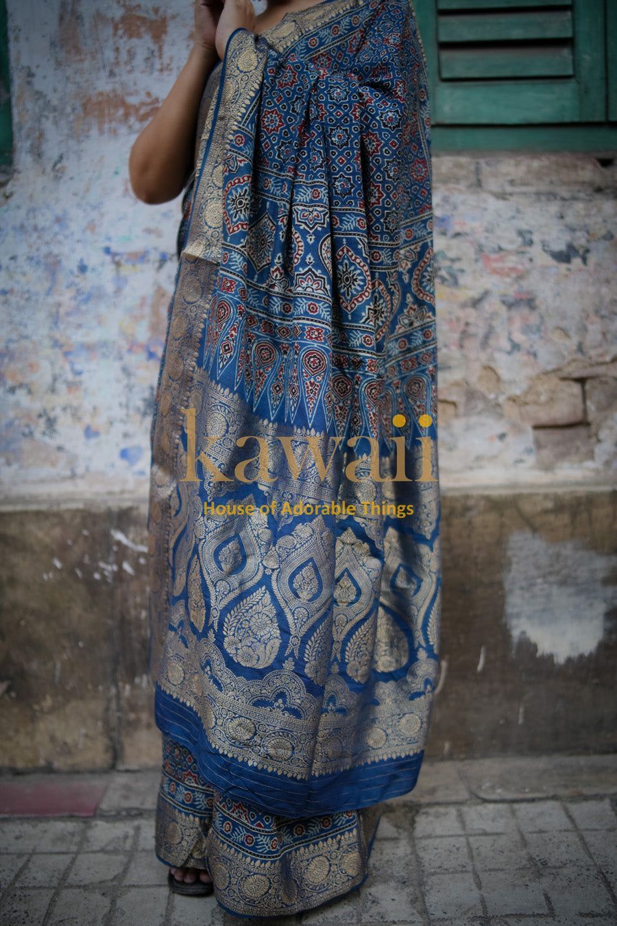 Kawaii ajrakh saree in blue and beige with traditional intricate patterns draped on a model