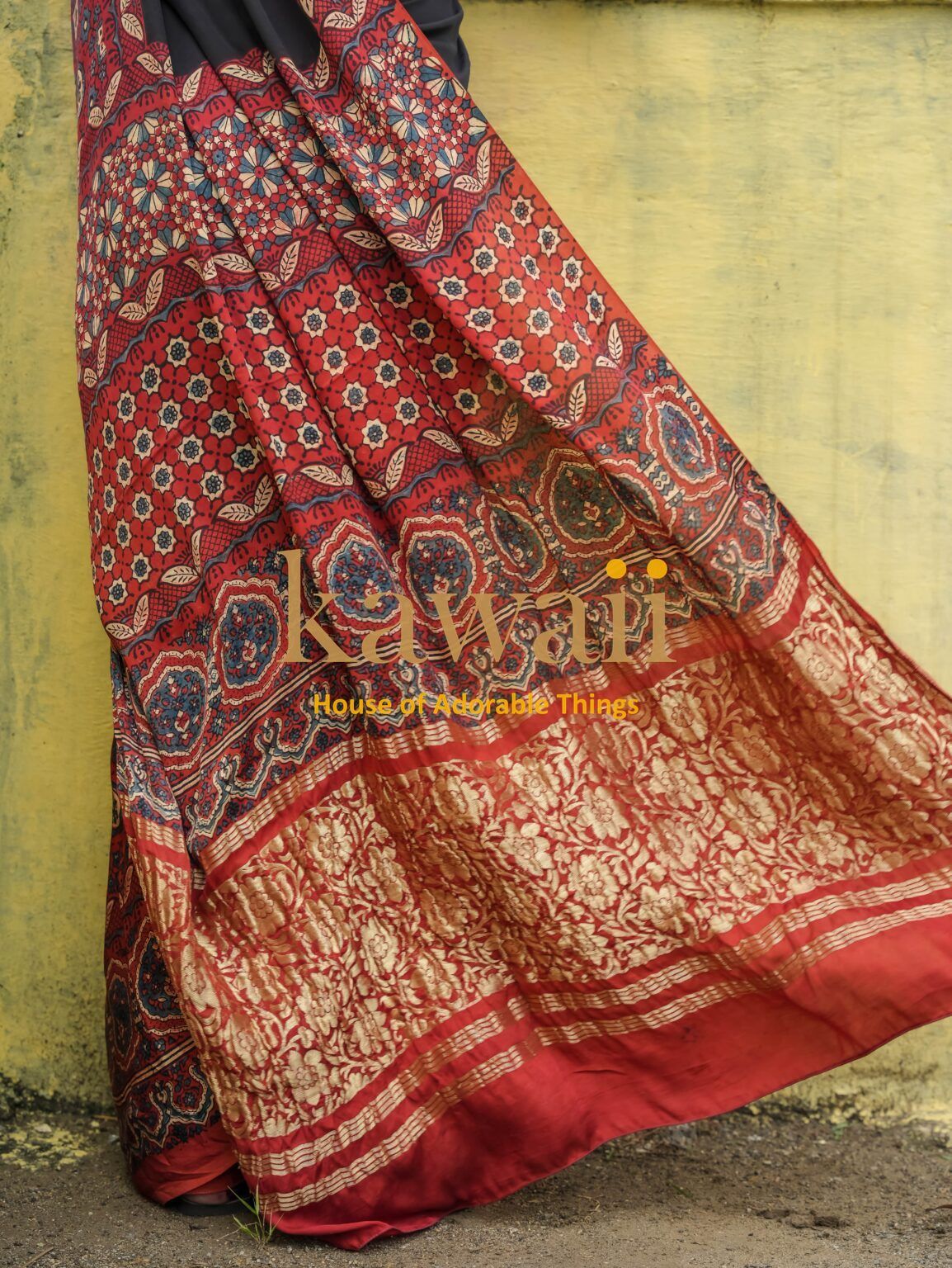 Kawaii ajrakh saree with intricate red and black floral and geometric patterns on fabric