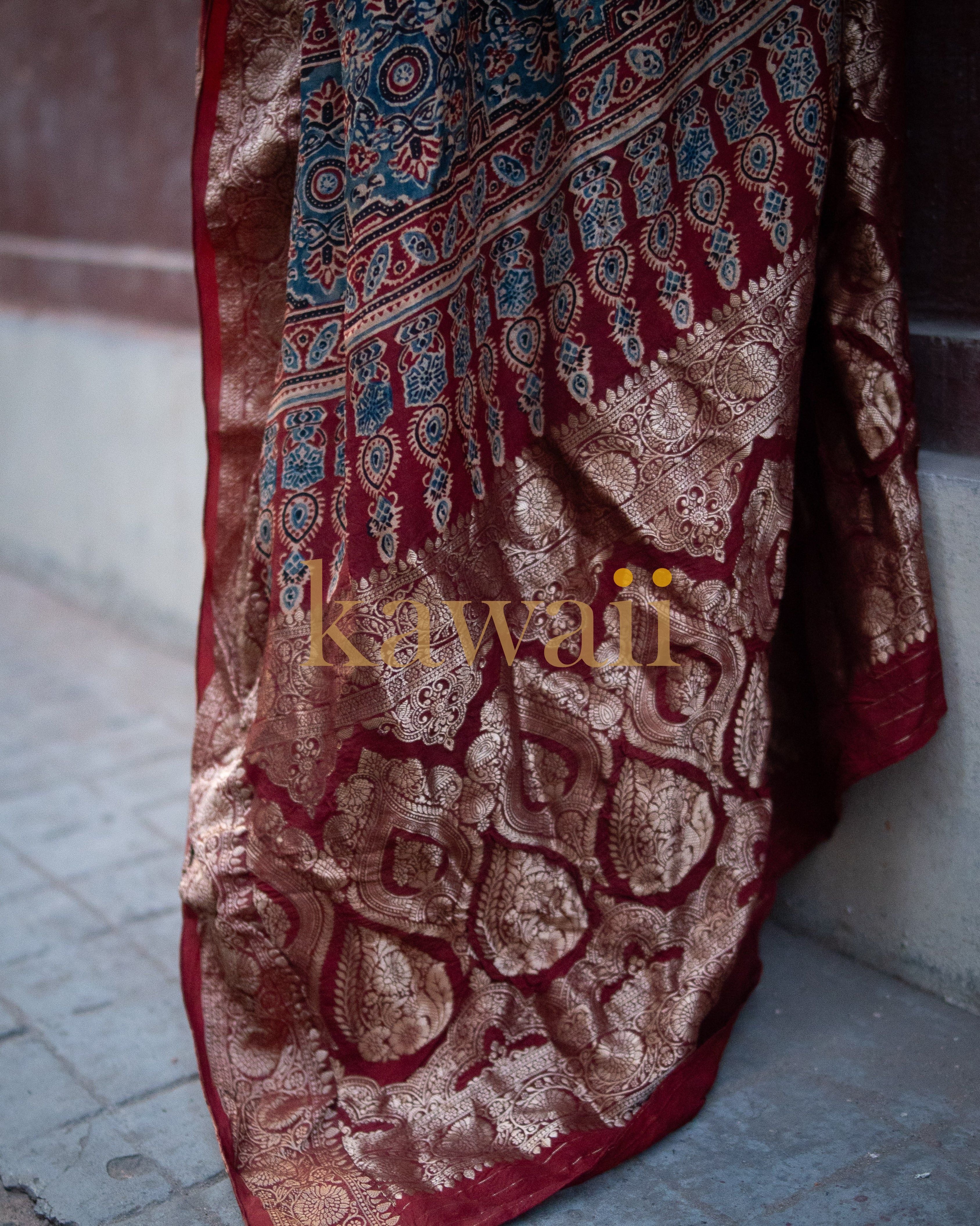 Kawaii ajrakh saree featuring traditional red, blue, and gold intricate patterns and designs