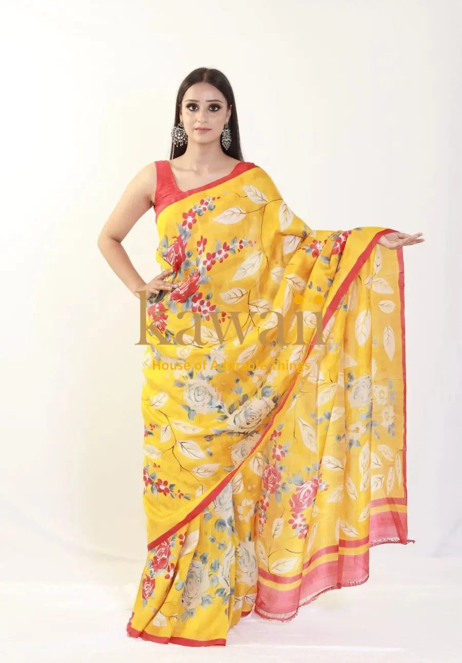 Kawaii yellow batik saree with floral patterns and pink border worn by a model