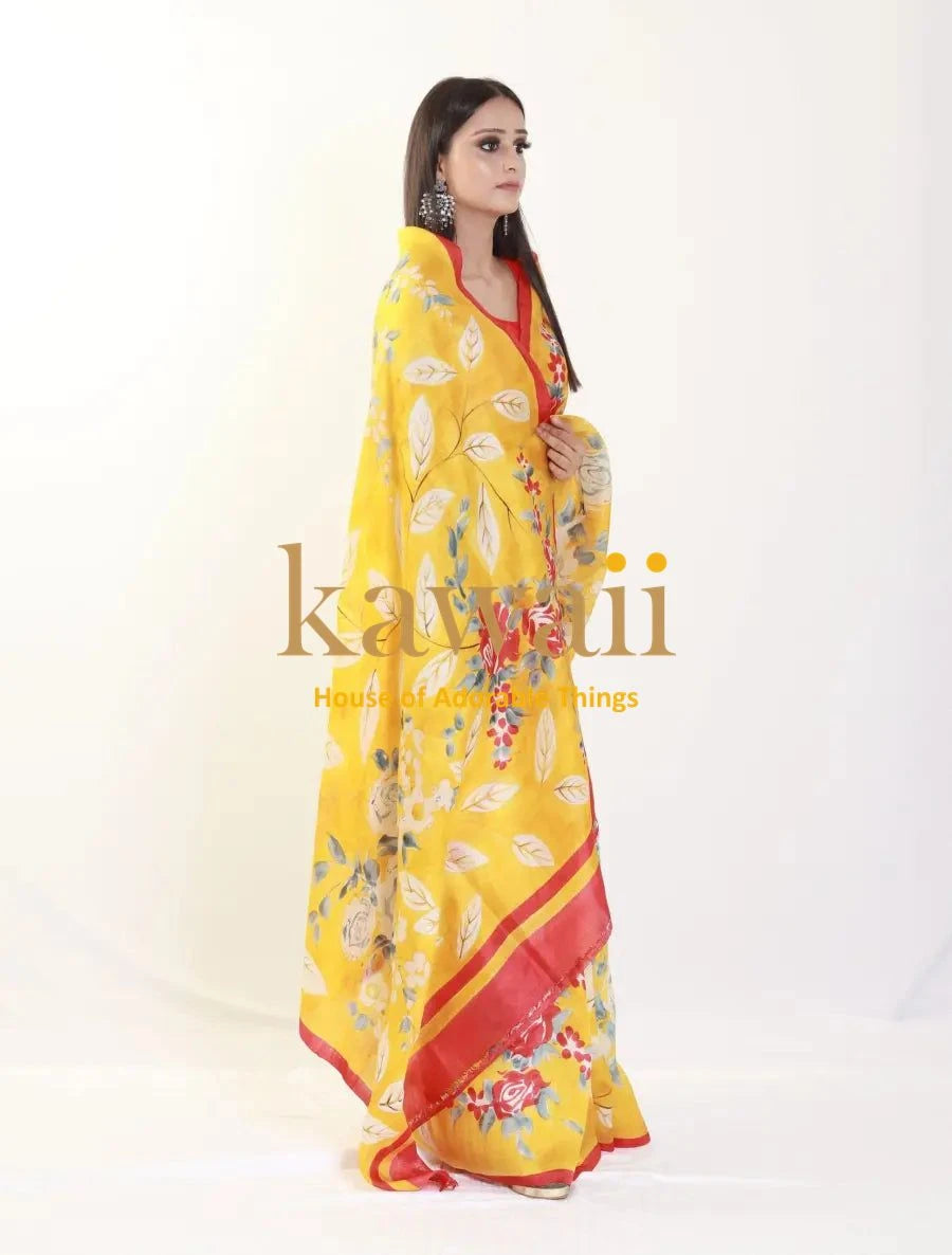 Yellow and red floral batik saree worn by a woman with silver earrings from Kawaii