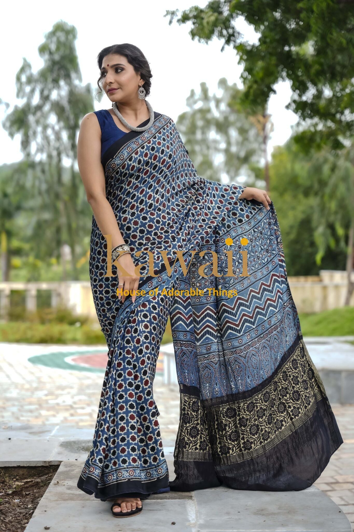 Woman wearing the best authentic handcrafted ajrakh saree online with intricate traditional patterns