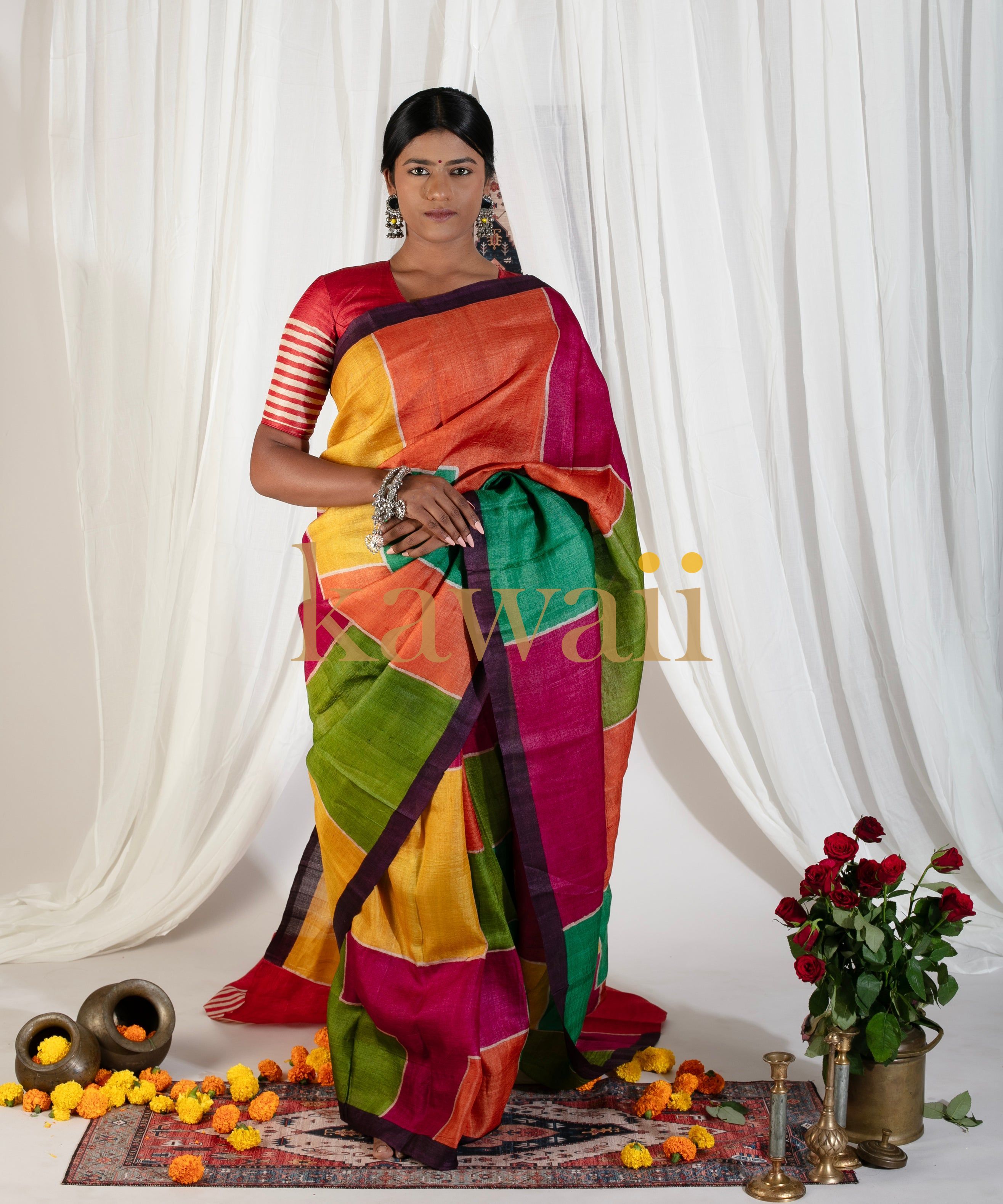 Kawaii block print saree in vibrant multicolor worn by model with traditional accessories