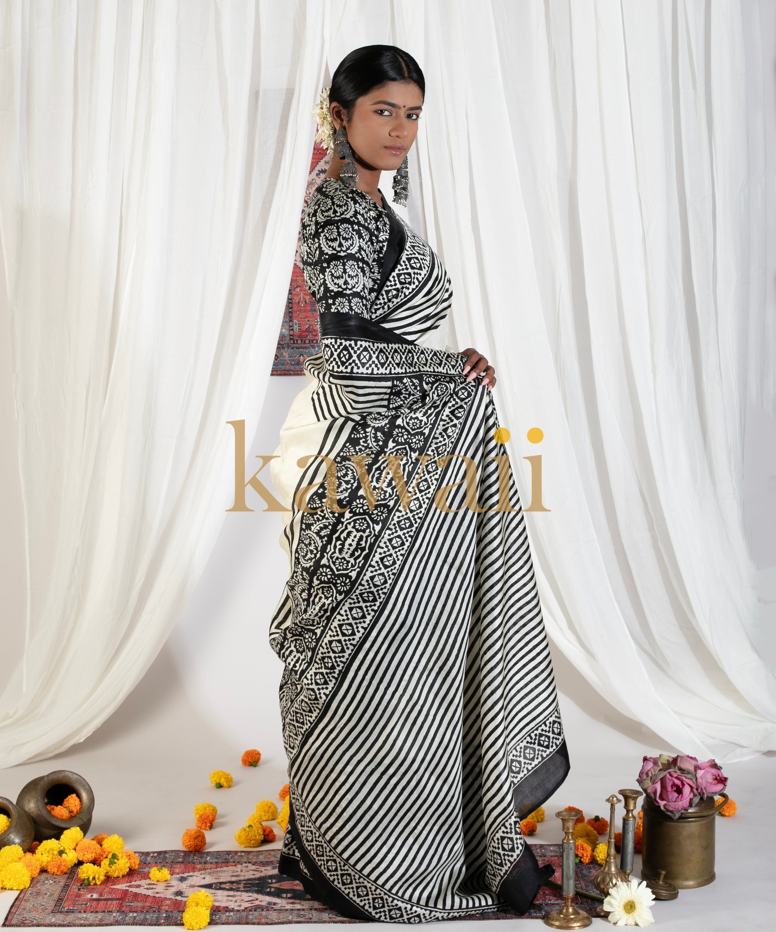 Elegant black and white block print saree by Kawaii with traditional floral and striped patterns