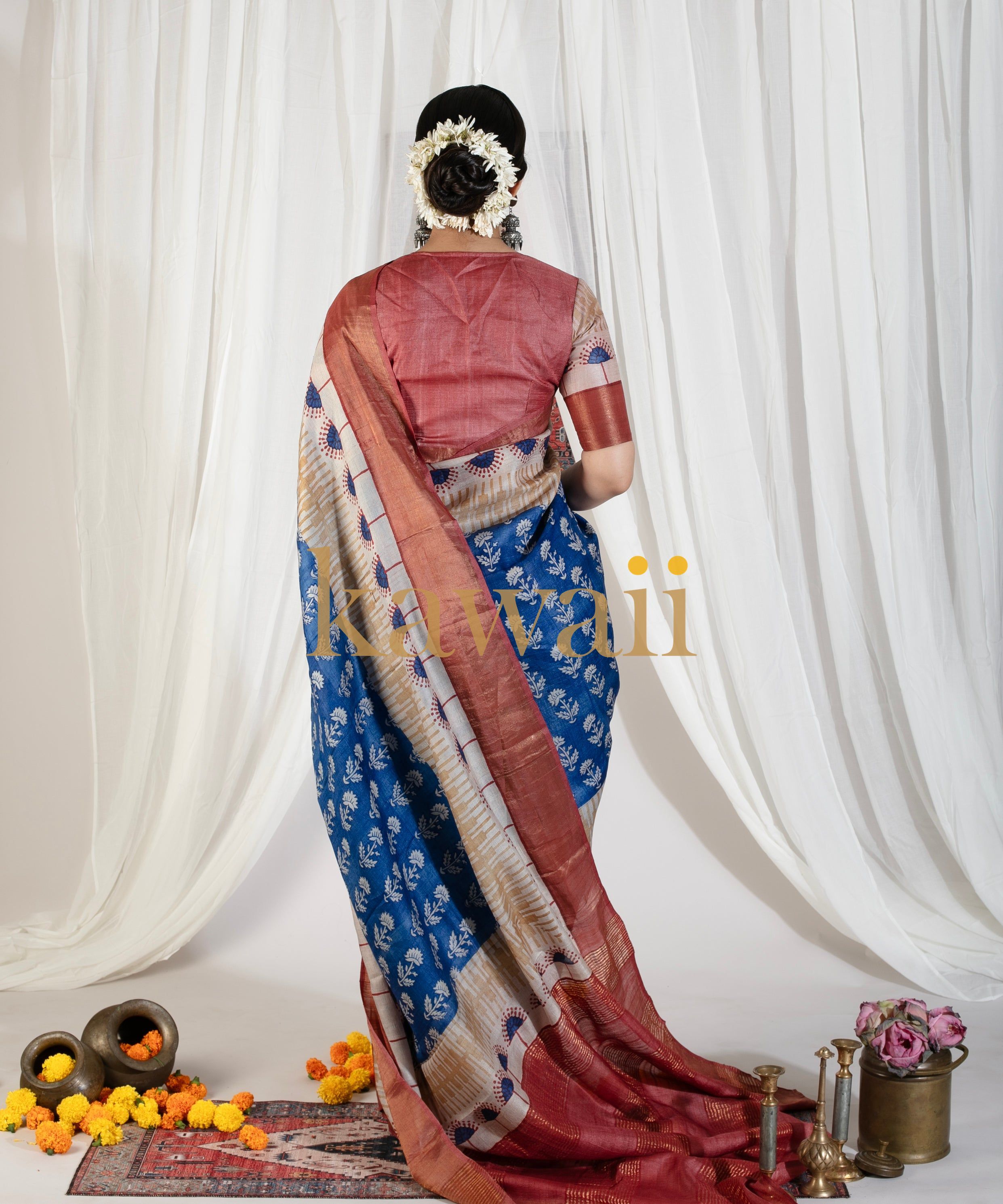 Elegant block print saree in blue with maroon accents, perfect for festive occasions and gatherings