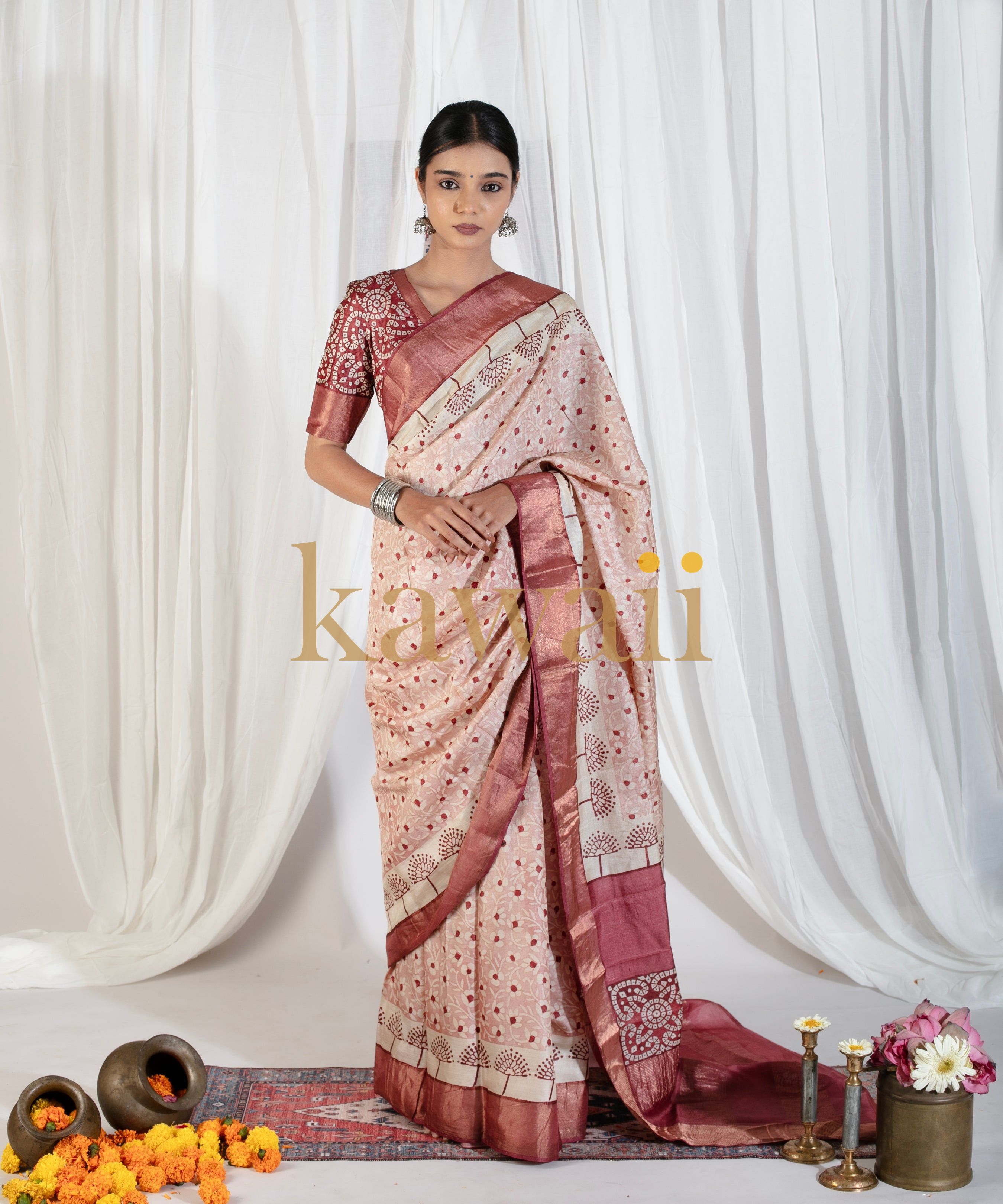 Kawaii elegant beige and maroon block print saree worn by model with traditional jewelry