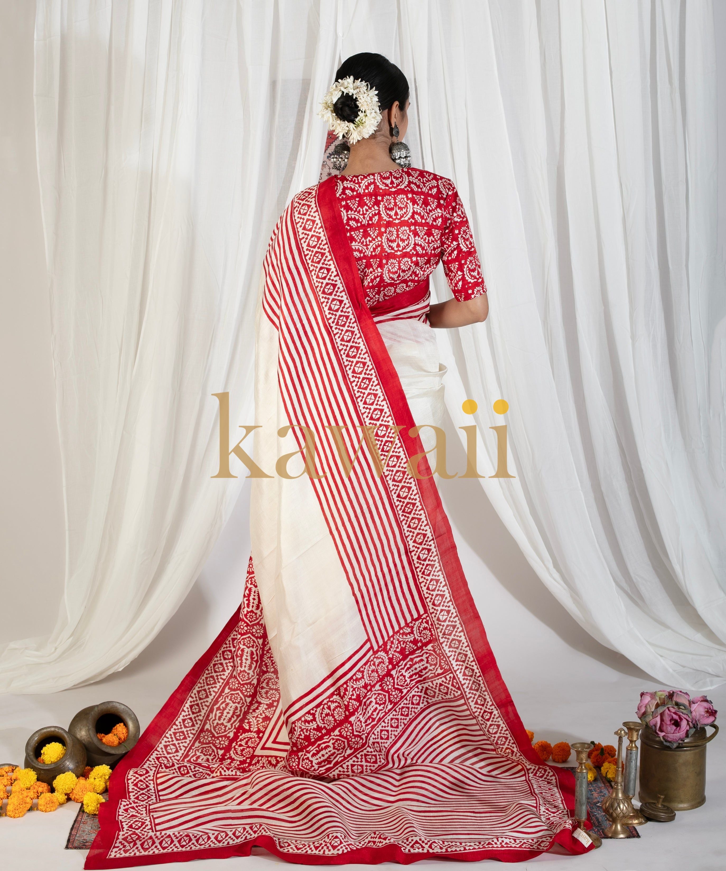 Kawaii elegant red and white block print saree with floral and striped patterns draped on model