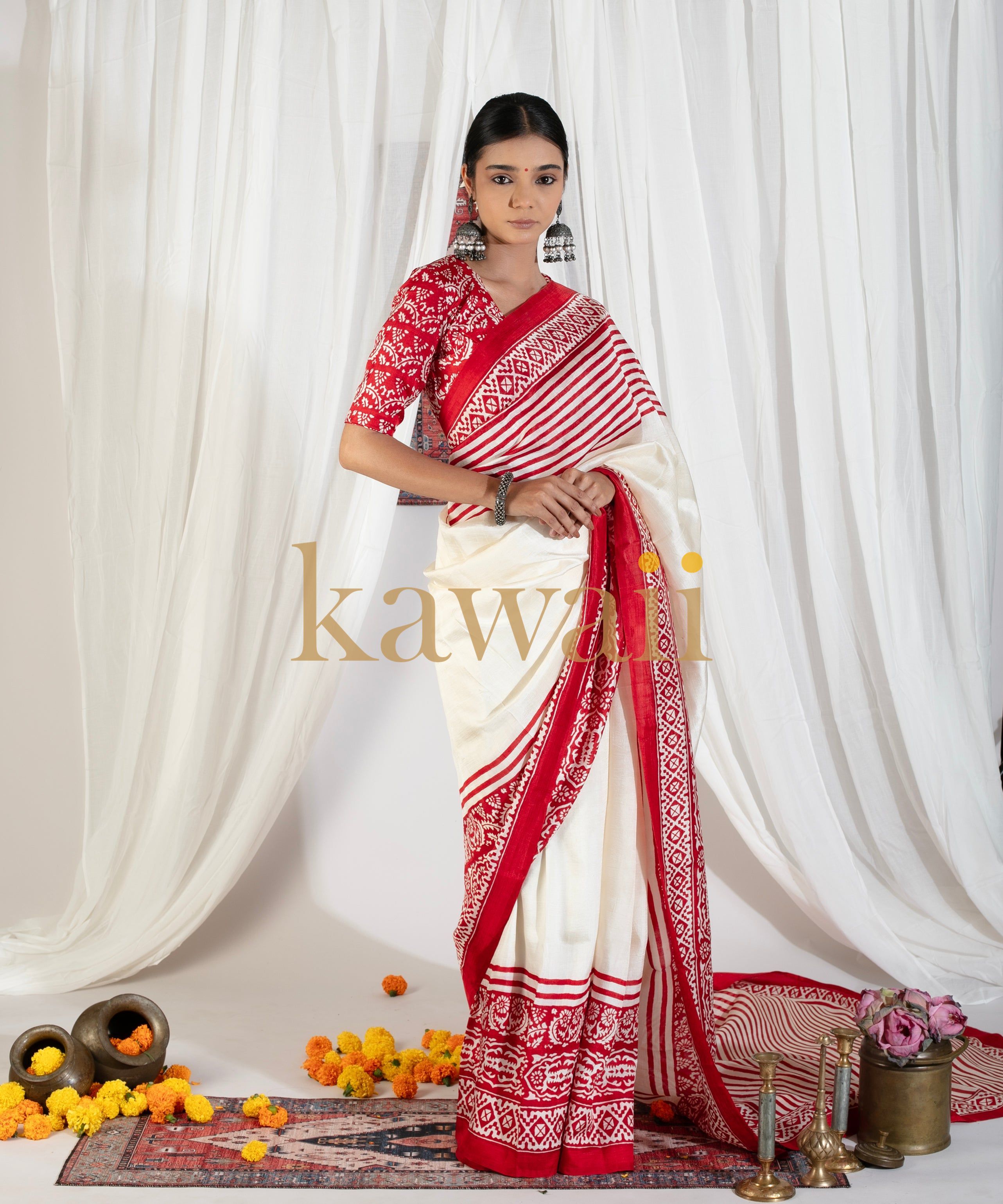 Kawaii block print saree in white and red with traditional geometric patterns worn by model