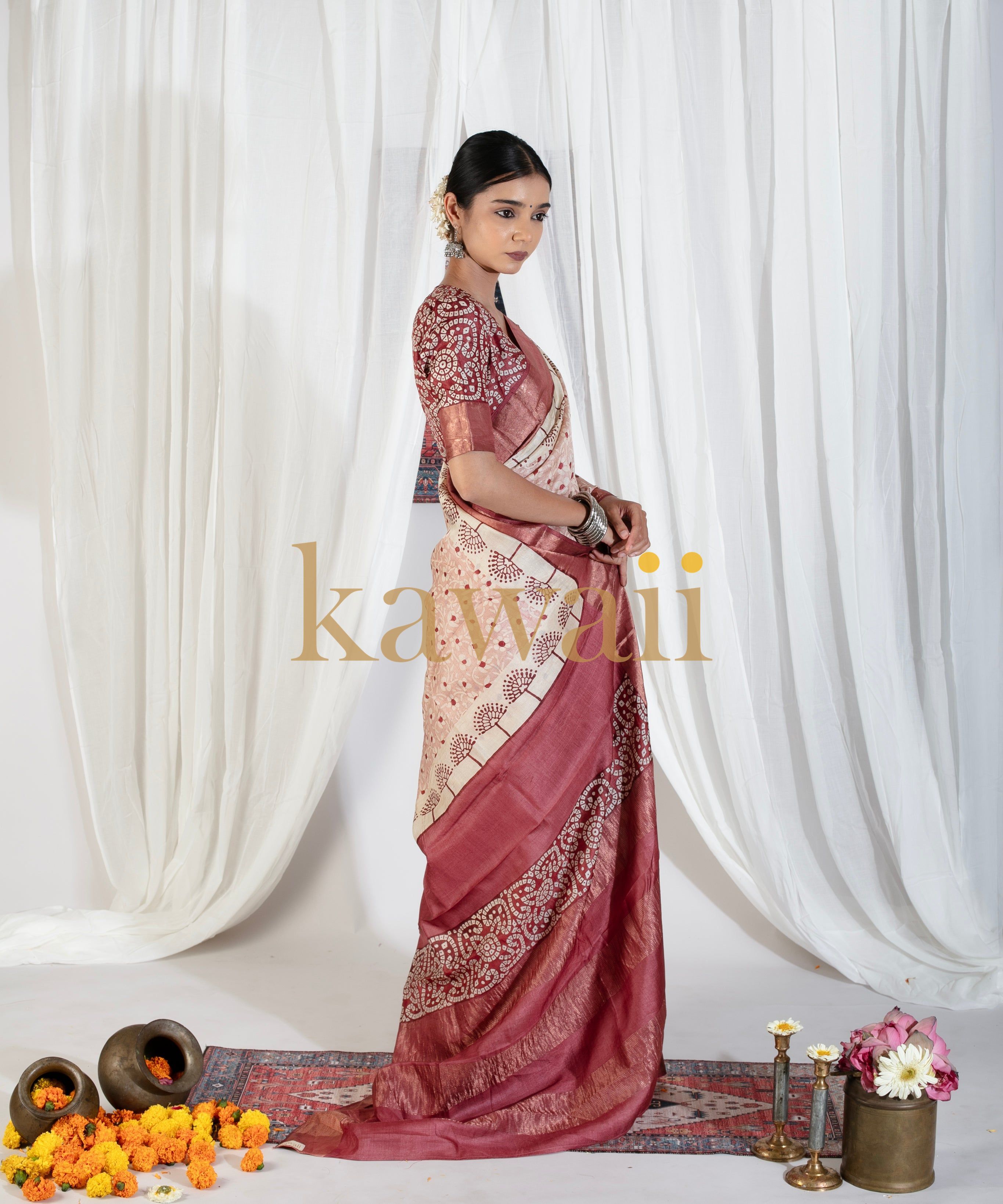 Model wearing a red and beige block print saree by Kawaii with intricate patterns and traditional design