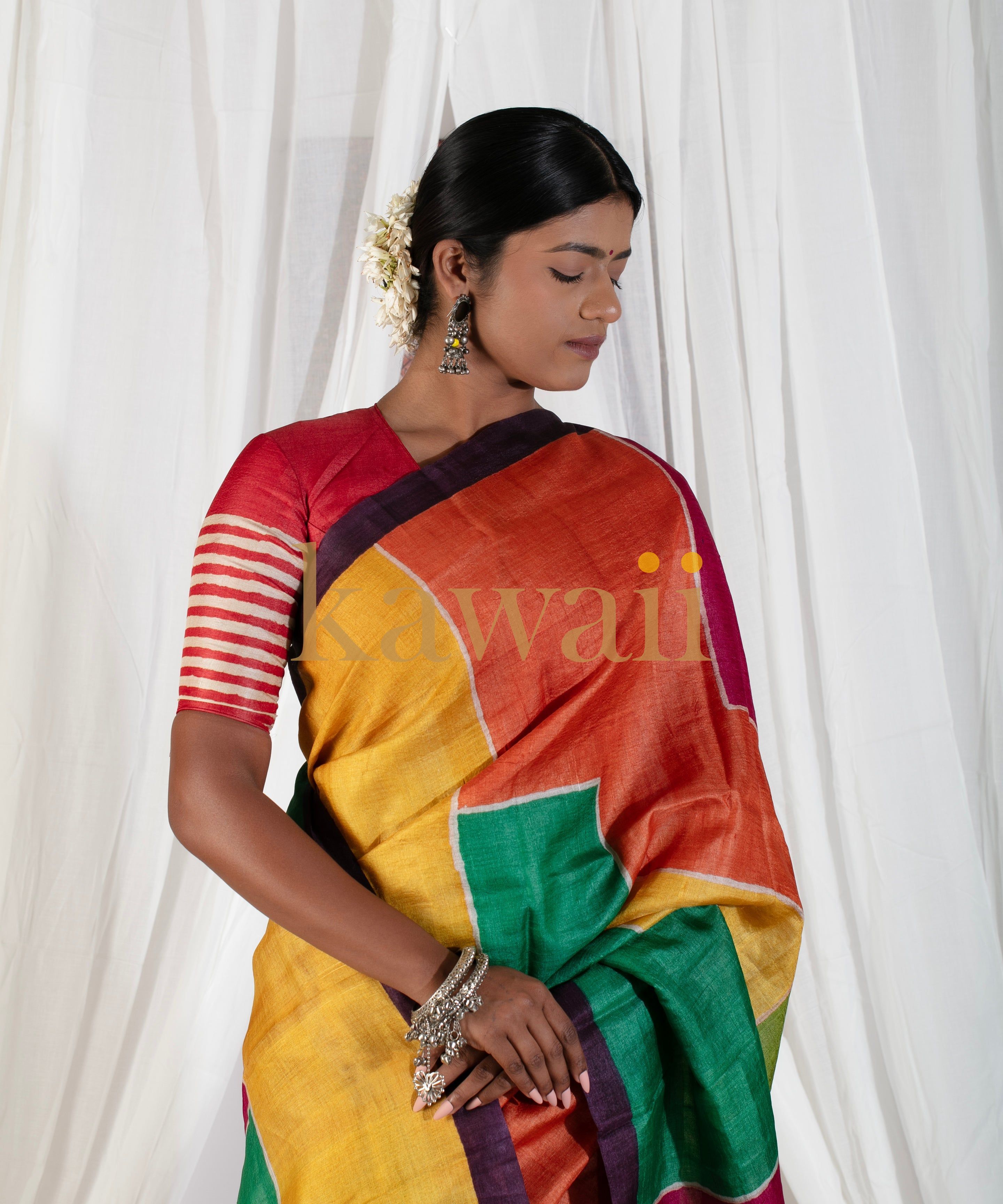 Kawaii vibrant block print saree in orange yellow green with contrasting blouse and traditional jewelry