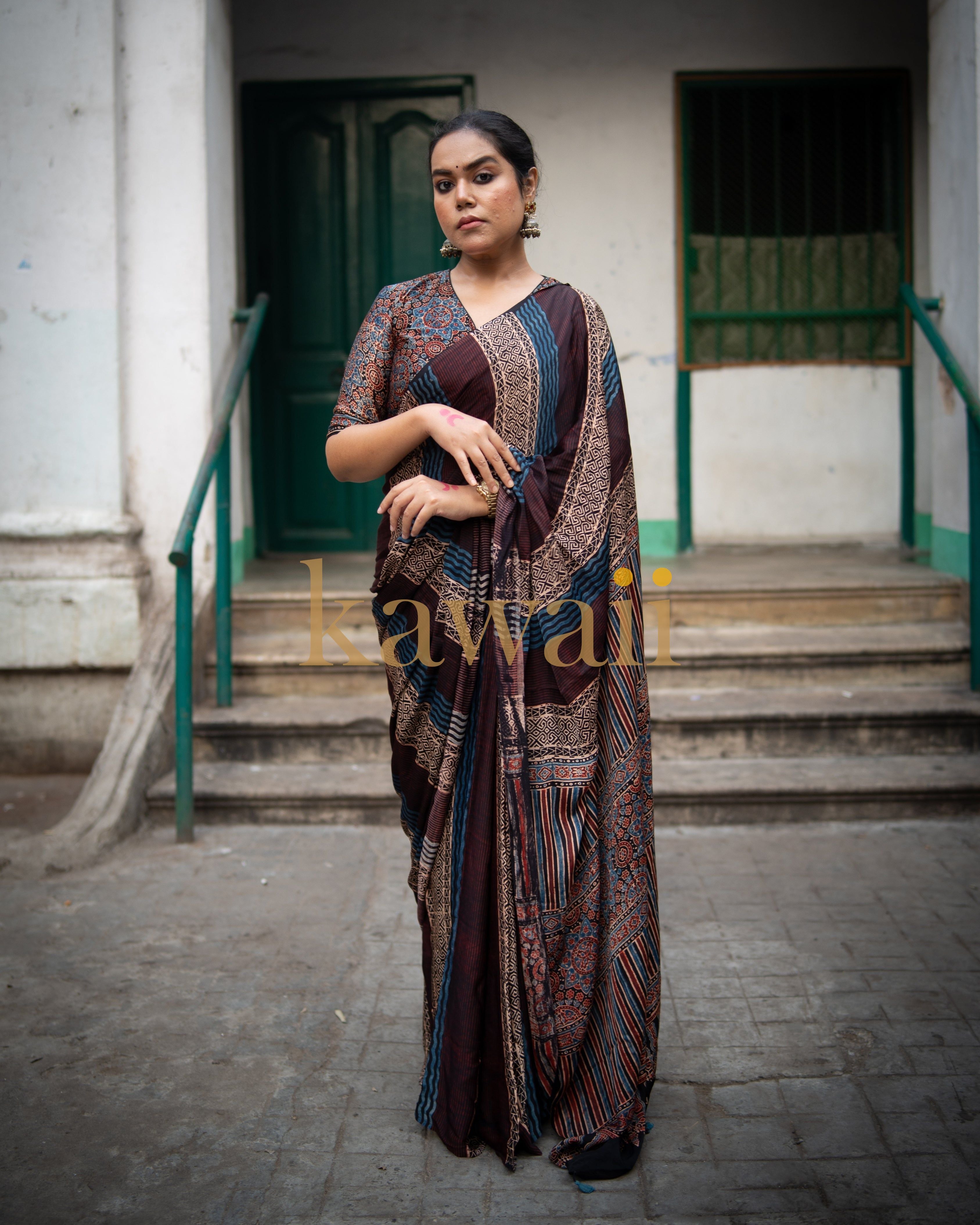 Woman wearing a handcrafted ajrakh saree by Kawaii with intricate traditional patterns