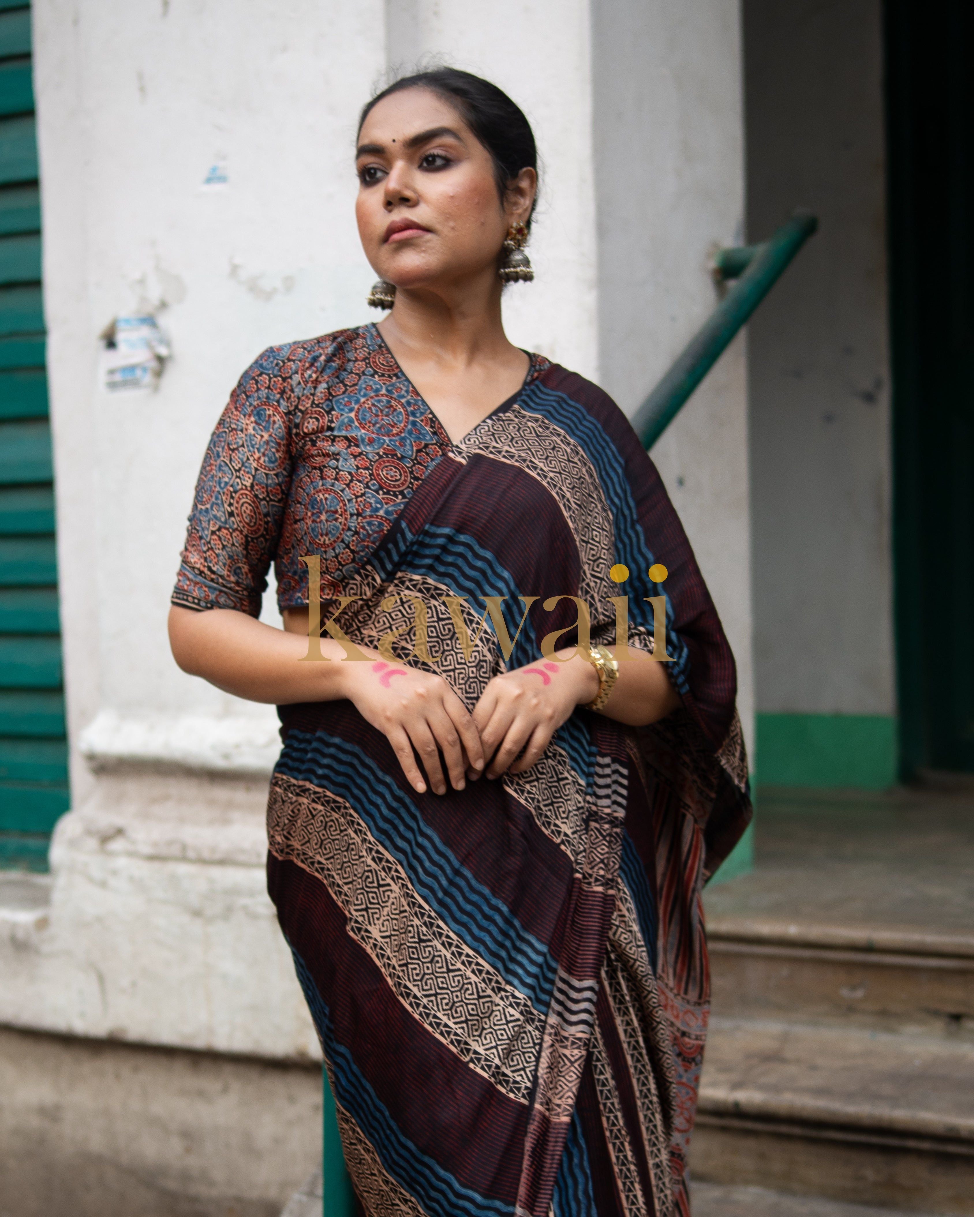 Woman wearing a handcrafted ajrakh saree with traditional intricate patterns by Kawaii