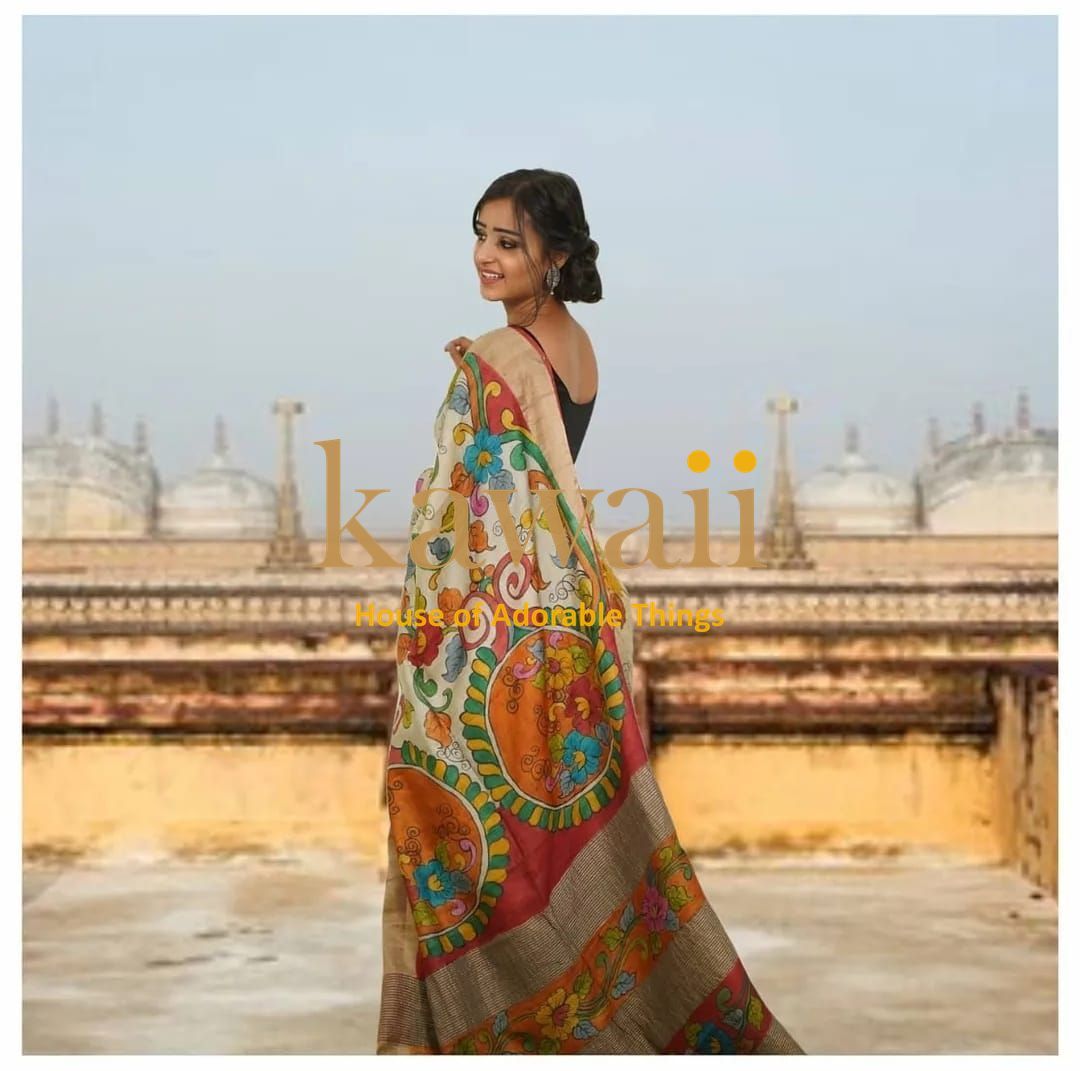 Kawaii kalamkari saree with vibrant floral and traditional circular motifs worn by a woman outdoors