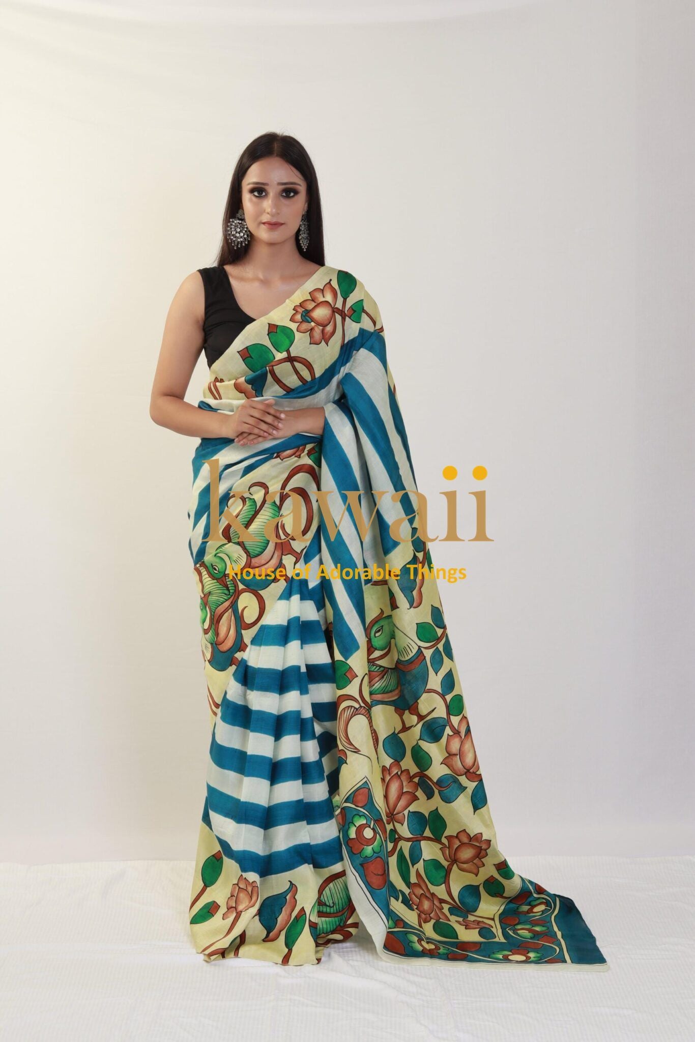 Kawaii kalamkari saree with floral and striped patterns worn by a woman in black blouse