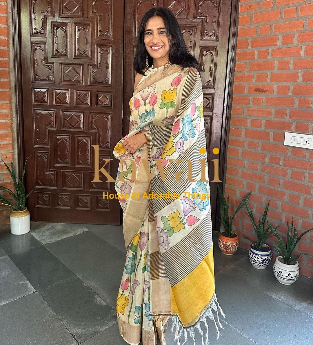 Kalamkari saree with colorful floral designs, crafted in soft fabric and styled elegantly