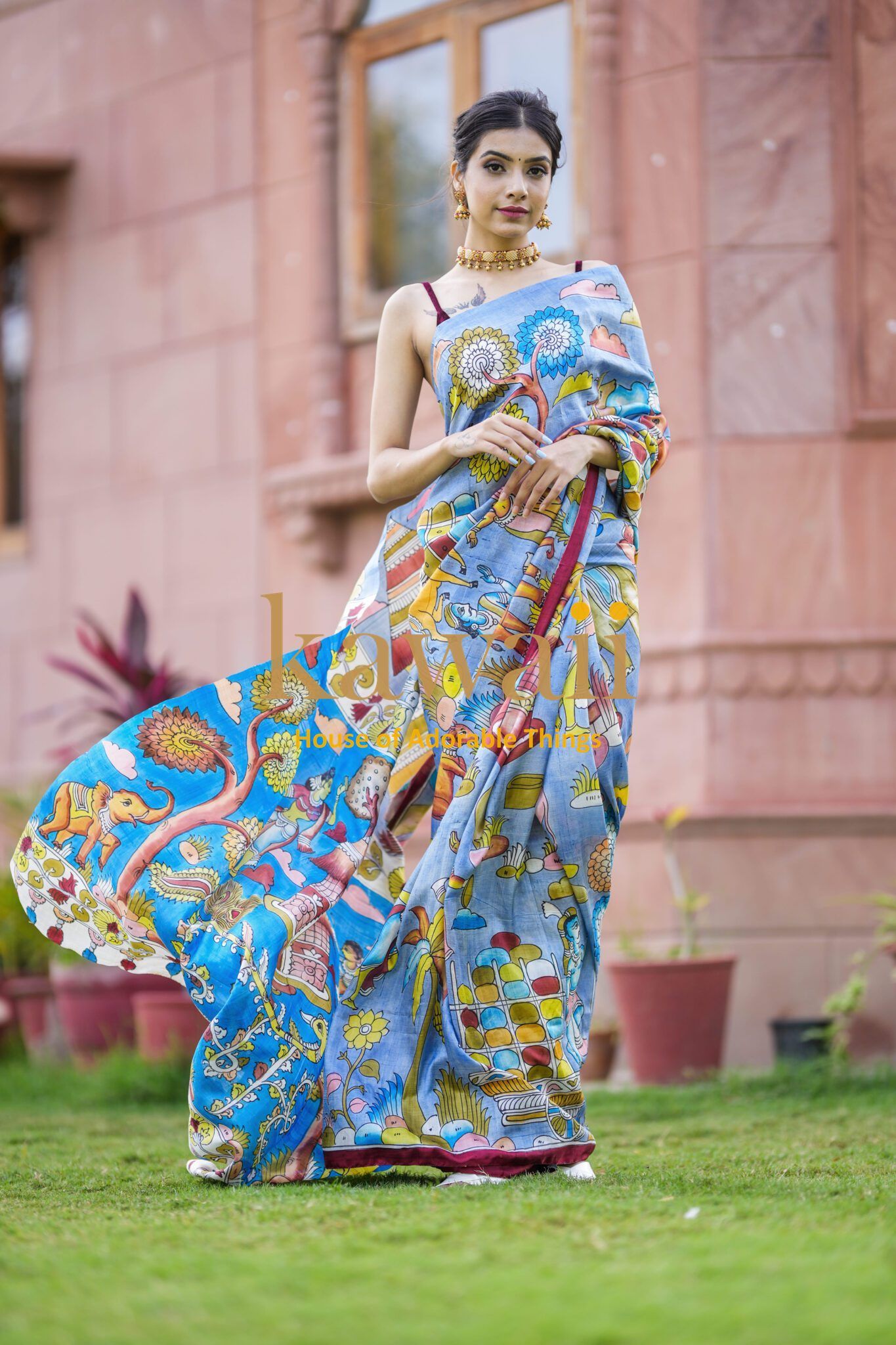 Kawaii kalamkari saree draped on woman featuring traditional colorful artistic patterns