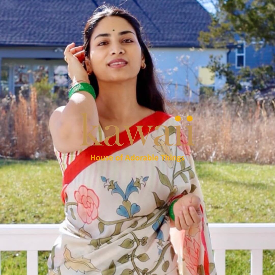 Woman wearing a Kawaii kalamkari saree online featuring floral handcrafted sarees in India design