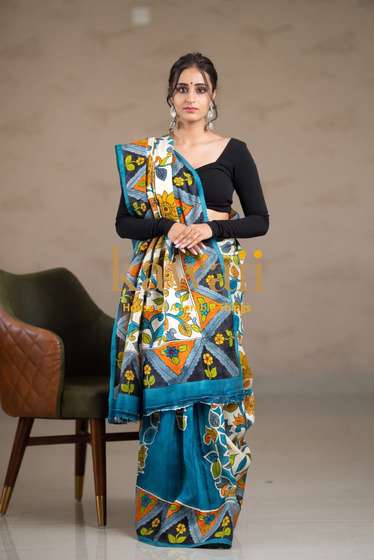 Kawaii kalamkari saree with vibrant floral and geometric patterns in blue, yellow, and white