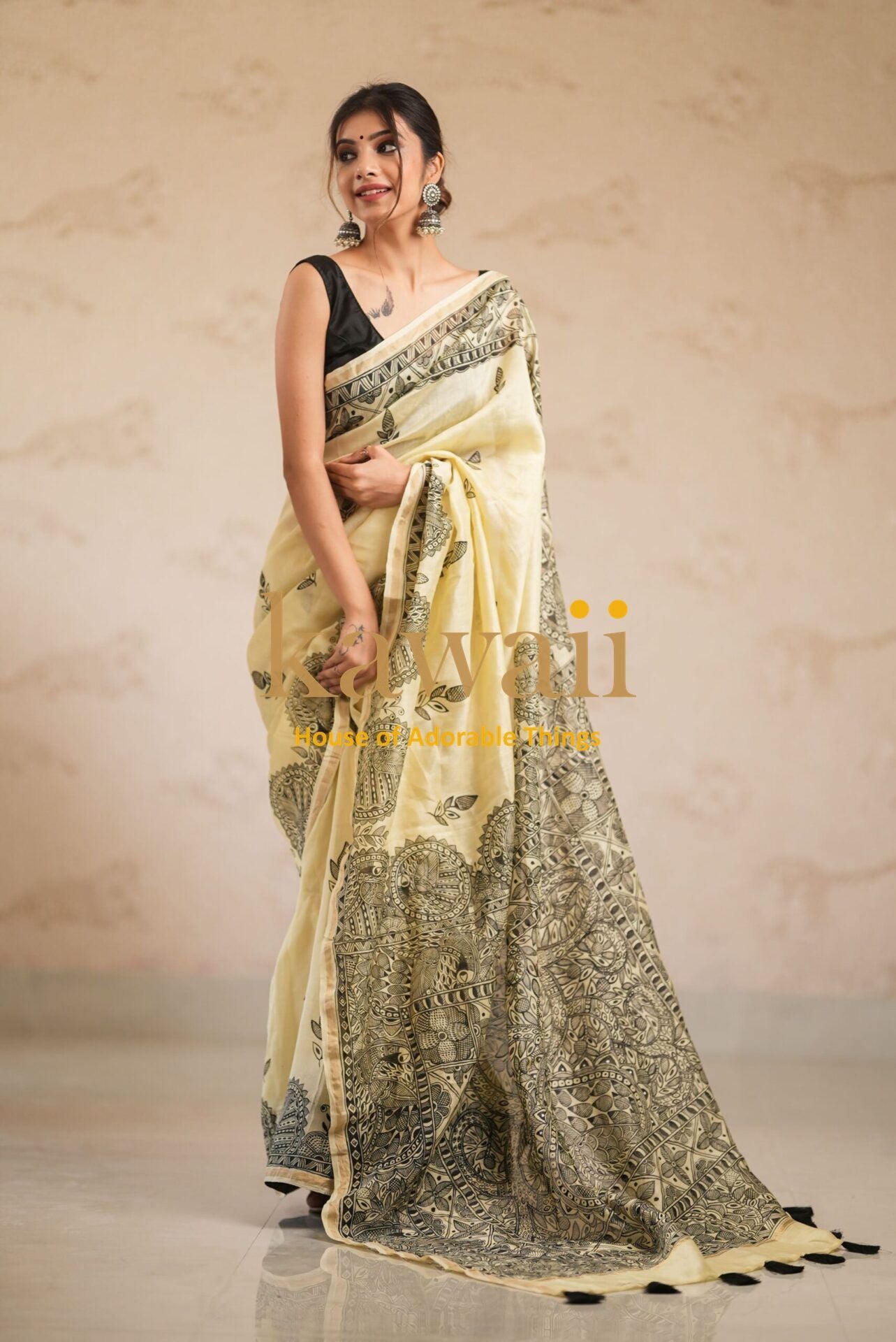 Woman wearing elegant yellow and black Madhubani saree by Kawaii with intricate traditional patterns