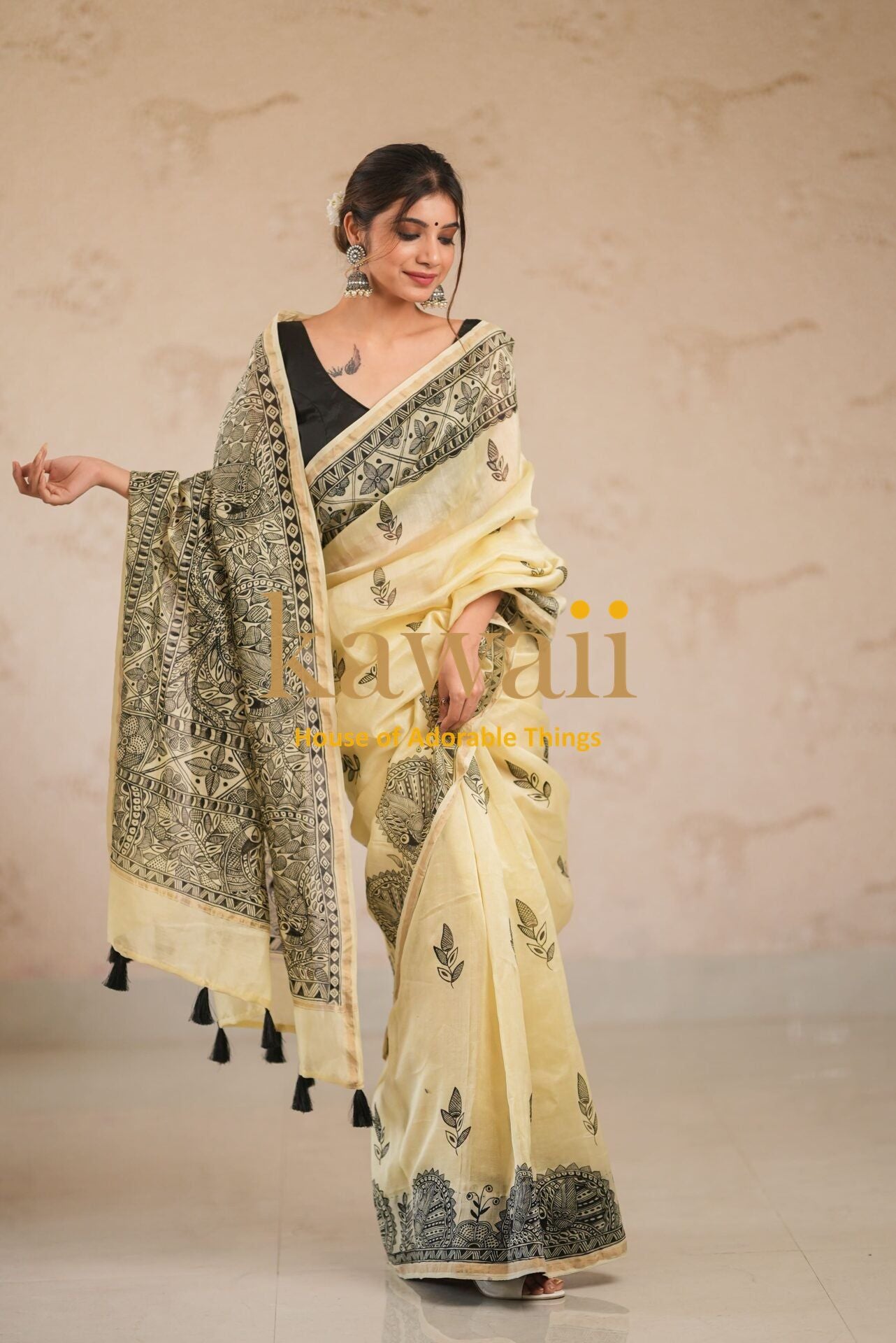Elegant Kawaii madhubani saree in cream with intricate black traditional patterns and tassels