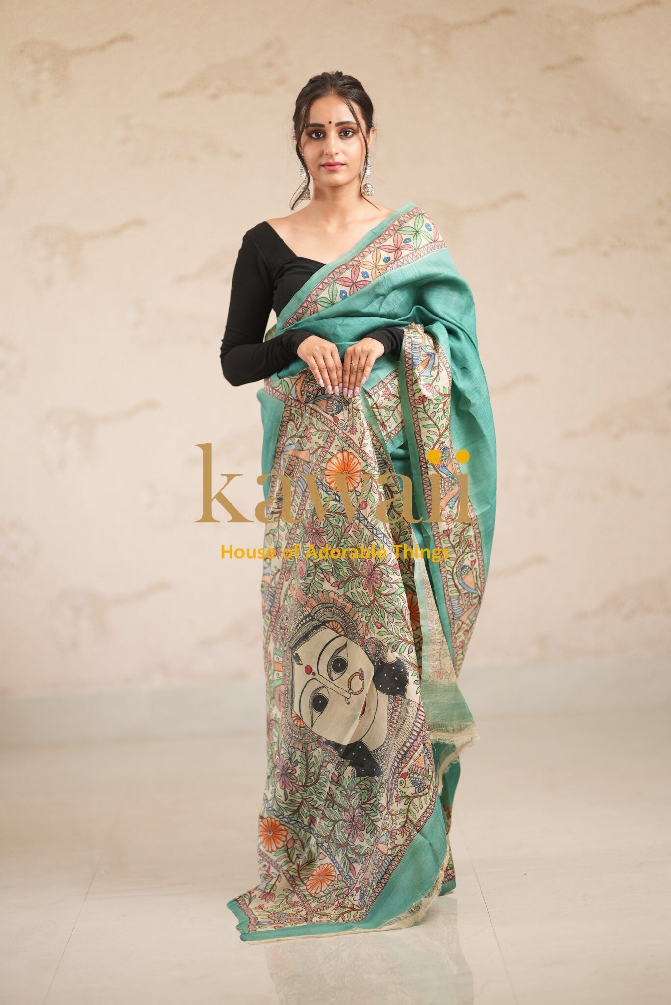 Kawaii madhubani saree in green with traditional hand-painted artistic designs worn by model