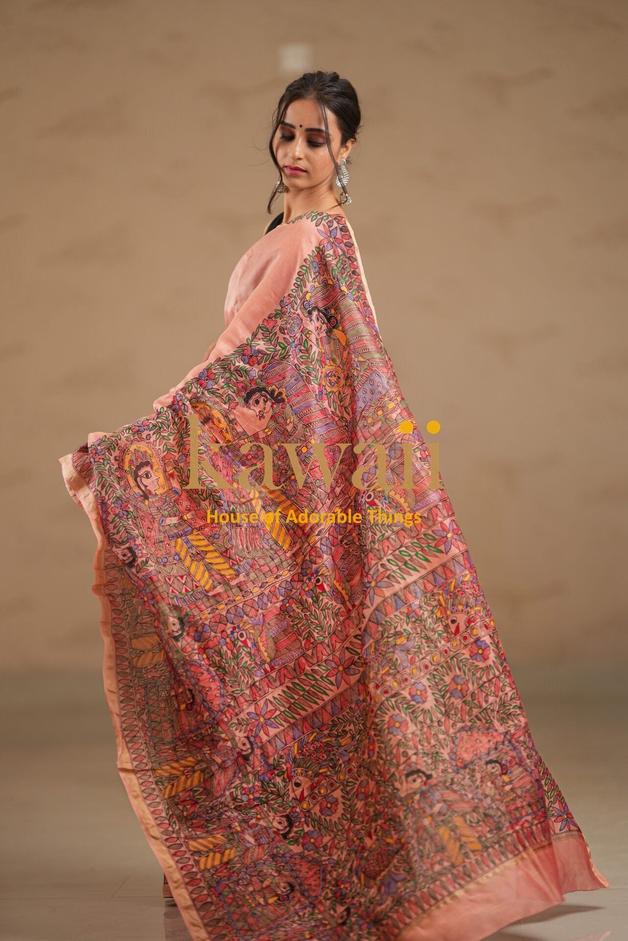 Kawaii madhubani saree in pink with intricate traditional detailed artwork draped on a woman
