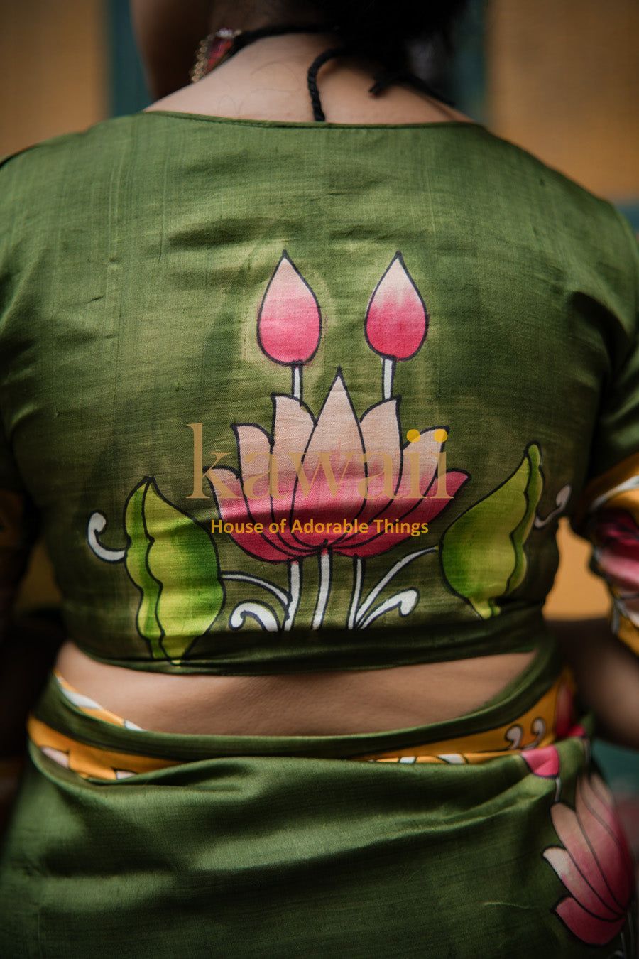 Green Pichwai saree blouse with hand-painted floral design by Kawaii showcasing traditional art