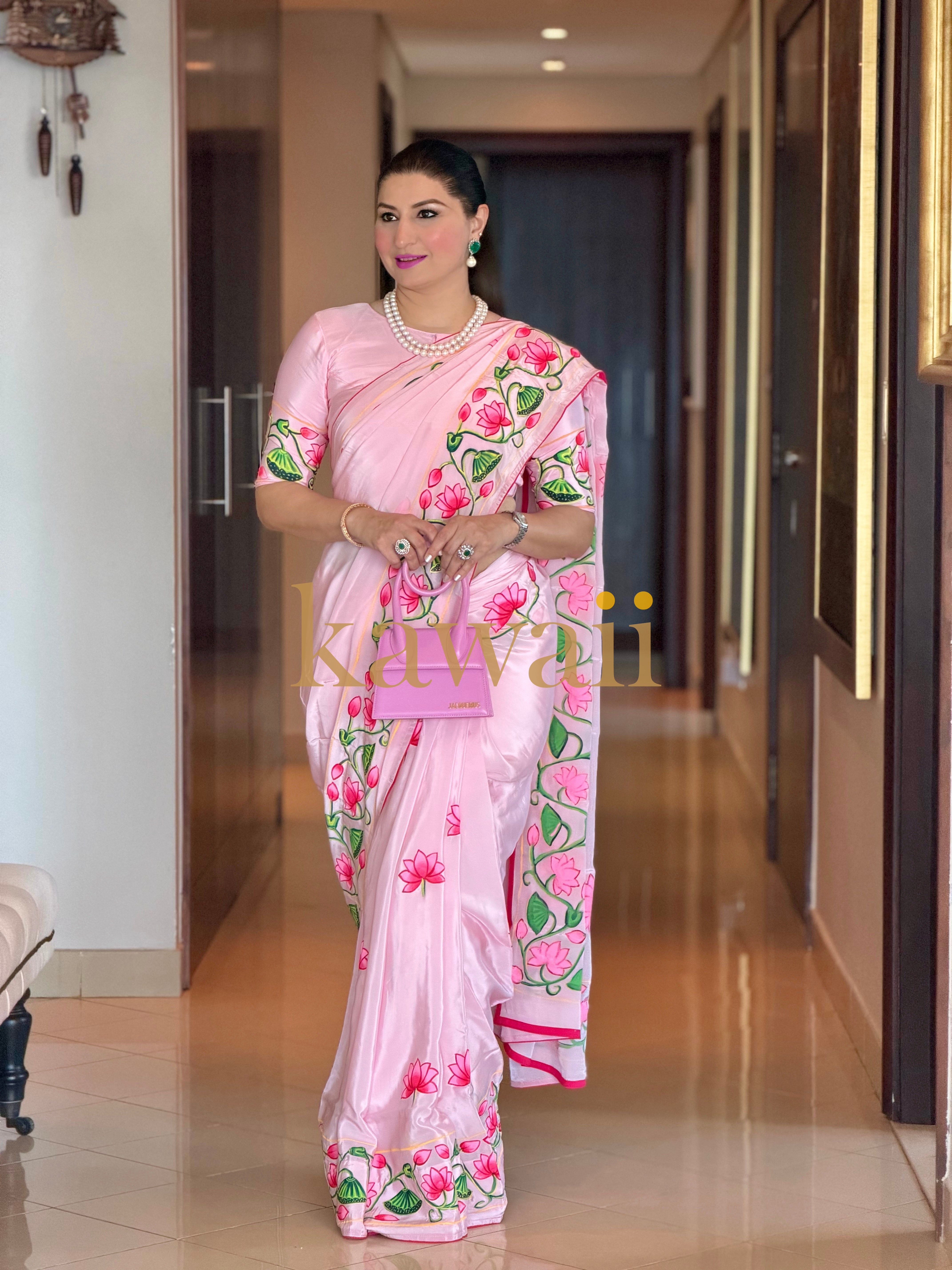 Elegant Pichwai saree in soft pink with floral designs and intricate detailing