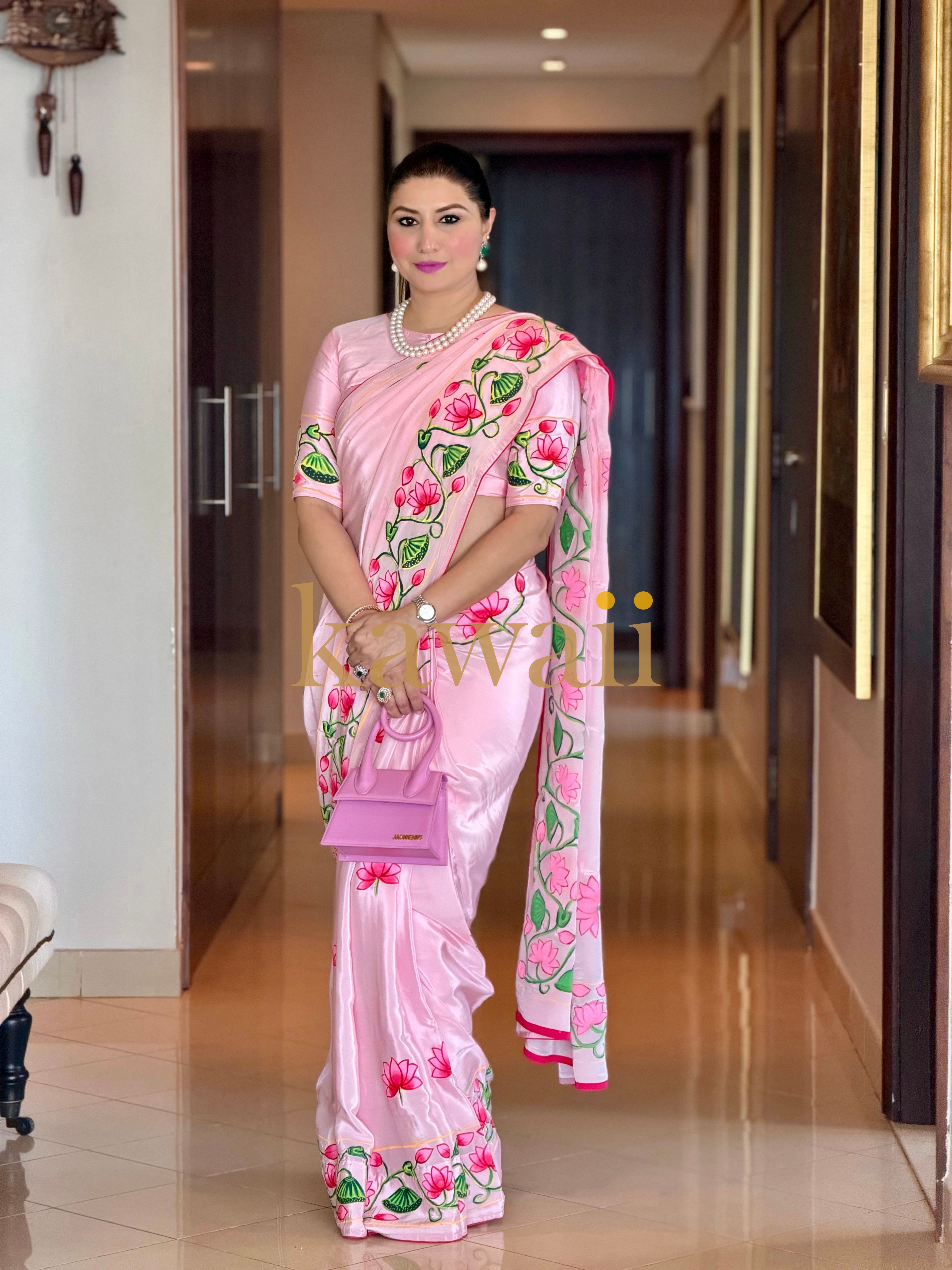 Elegant Pichwai Saree in soft pink with floral motifs, perfect for festive occasions
