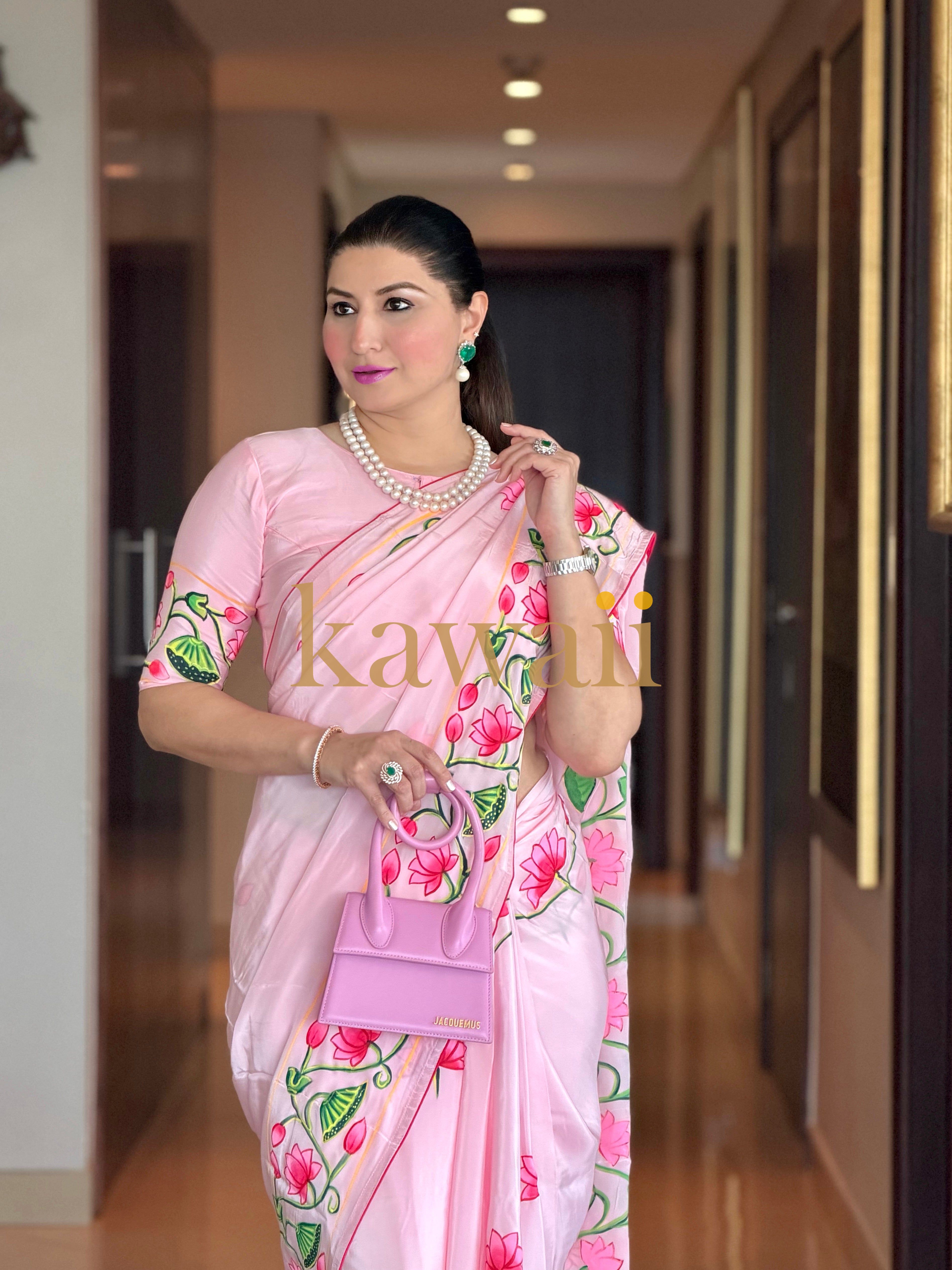 Elegant Kawaii pichwai saree in soft pink with floral designs, perfect for festive occasions.