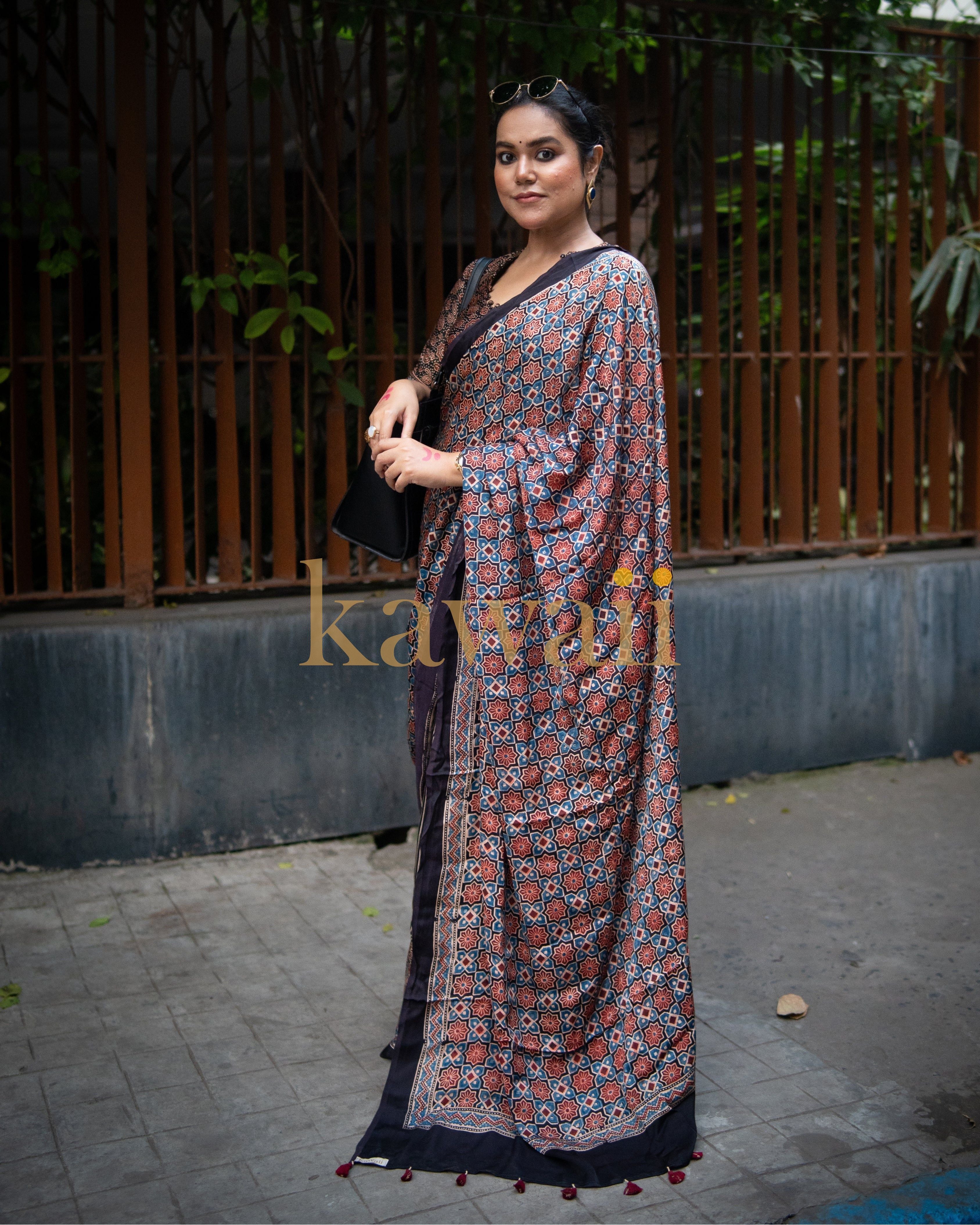 Woman wearing best authentic ajrakh saree by Kawaii with traditional intricate patterns