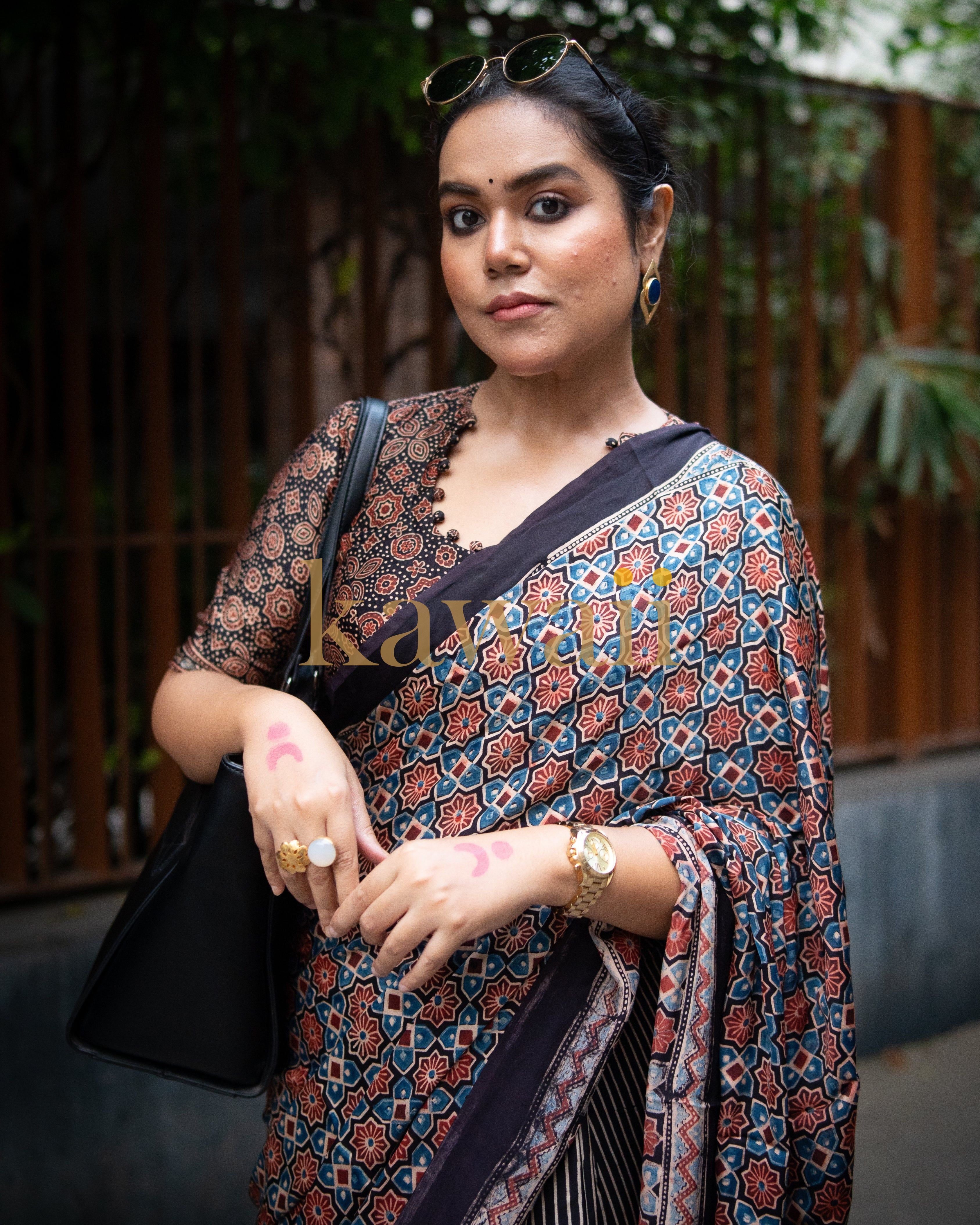 Woman wearing the best authentic ajrakh saree by Kawaii with geometric and floral patterns