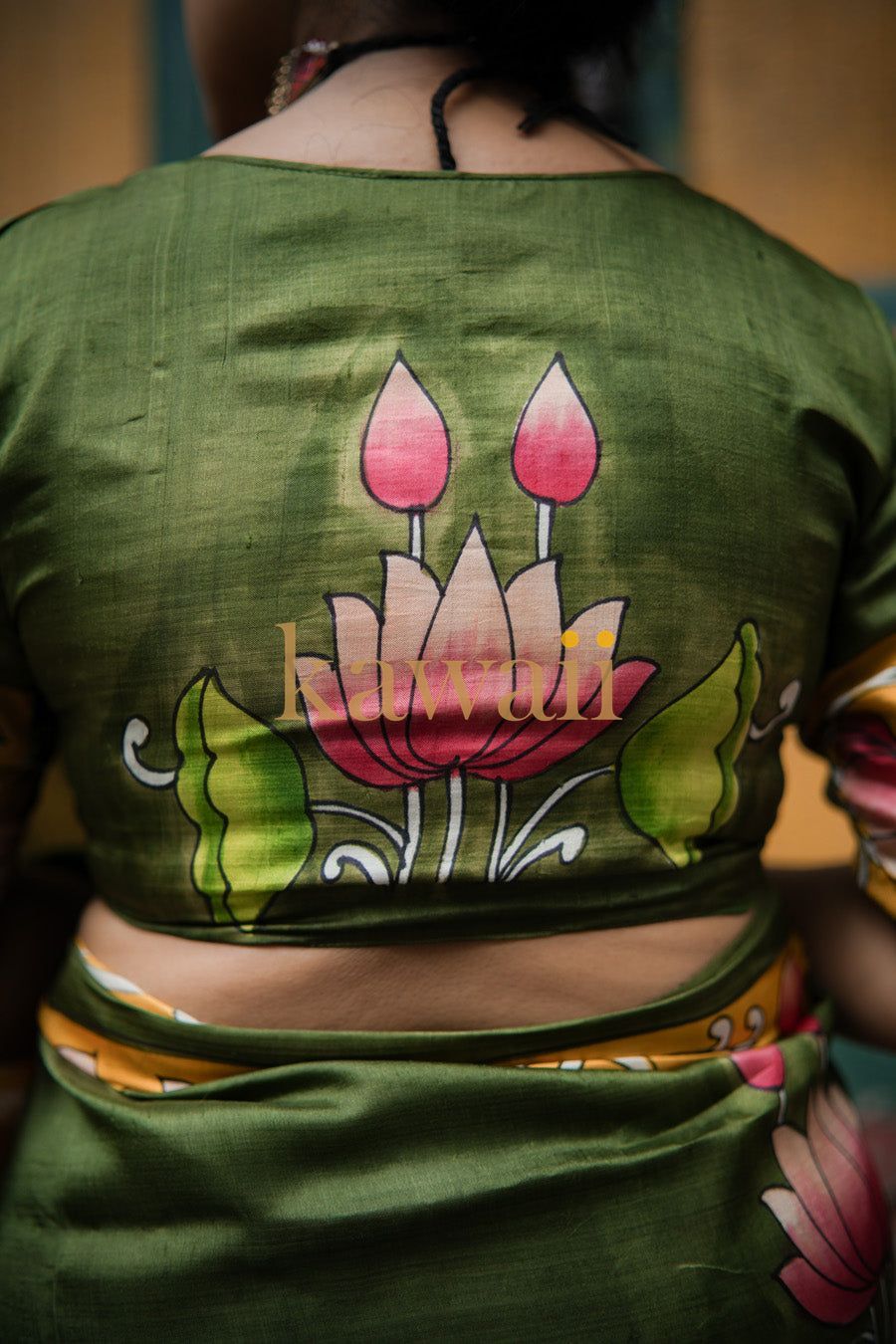 Green Pichwai saree blouse with hand-painted floral design by Kawaii showcasing traditional art