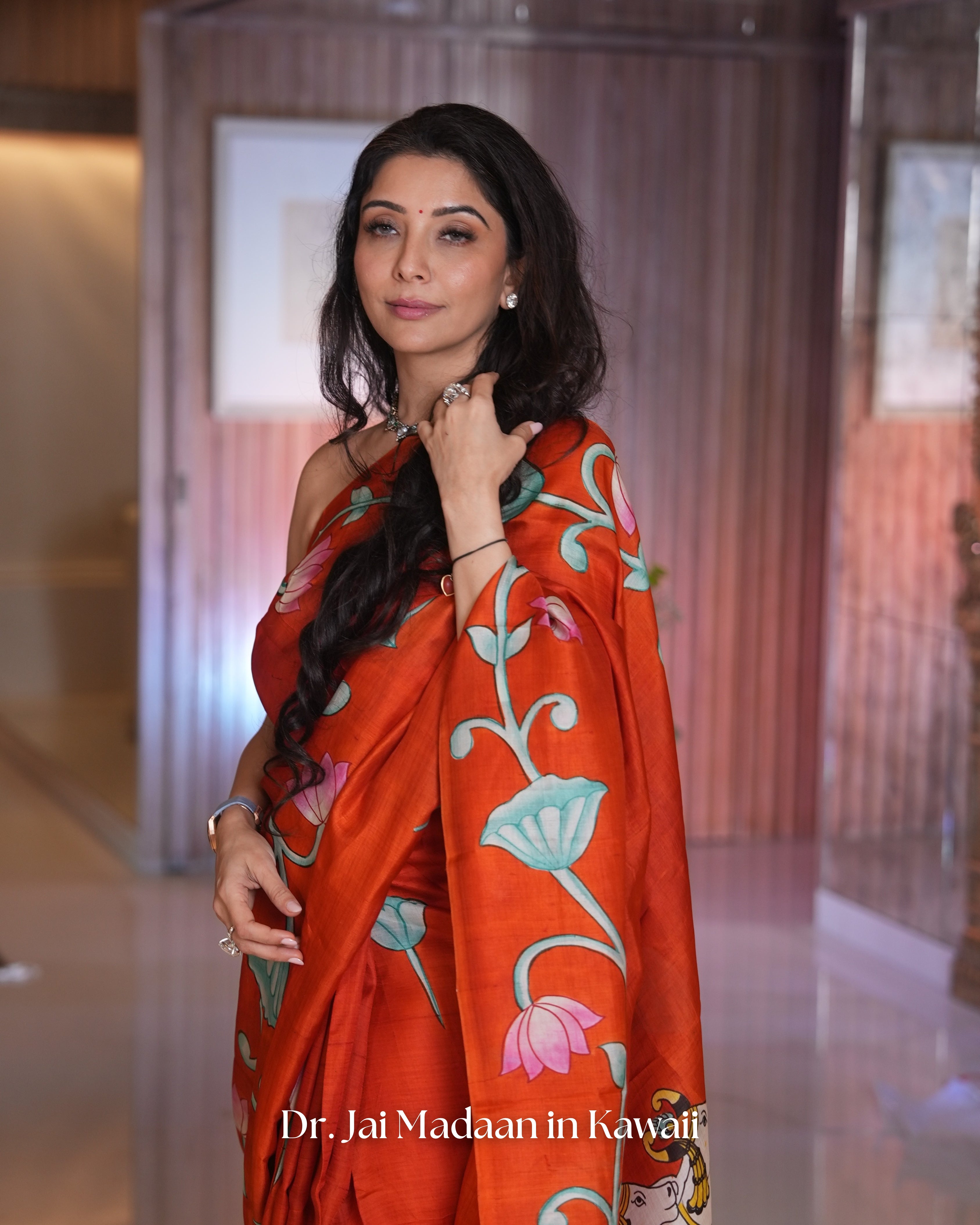 Elegant pichwai saree by Kawaii featuring intricate floral designs and vibrant colors