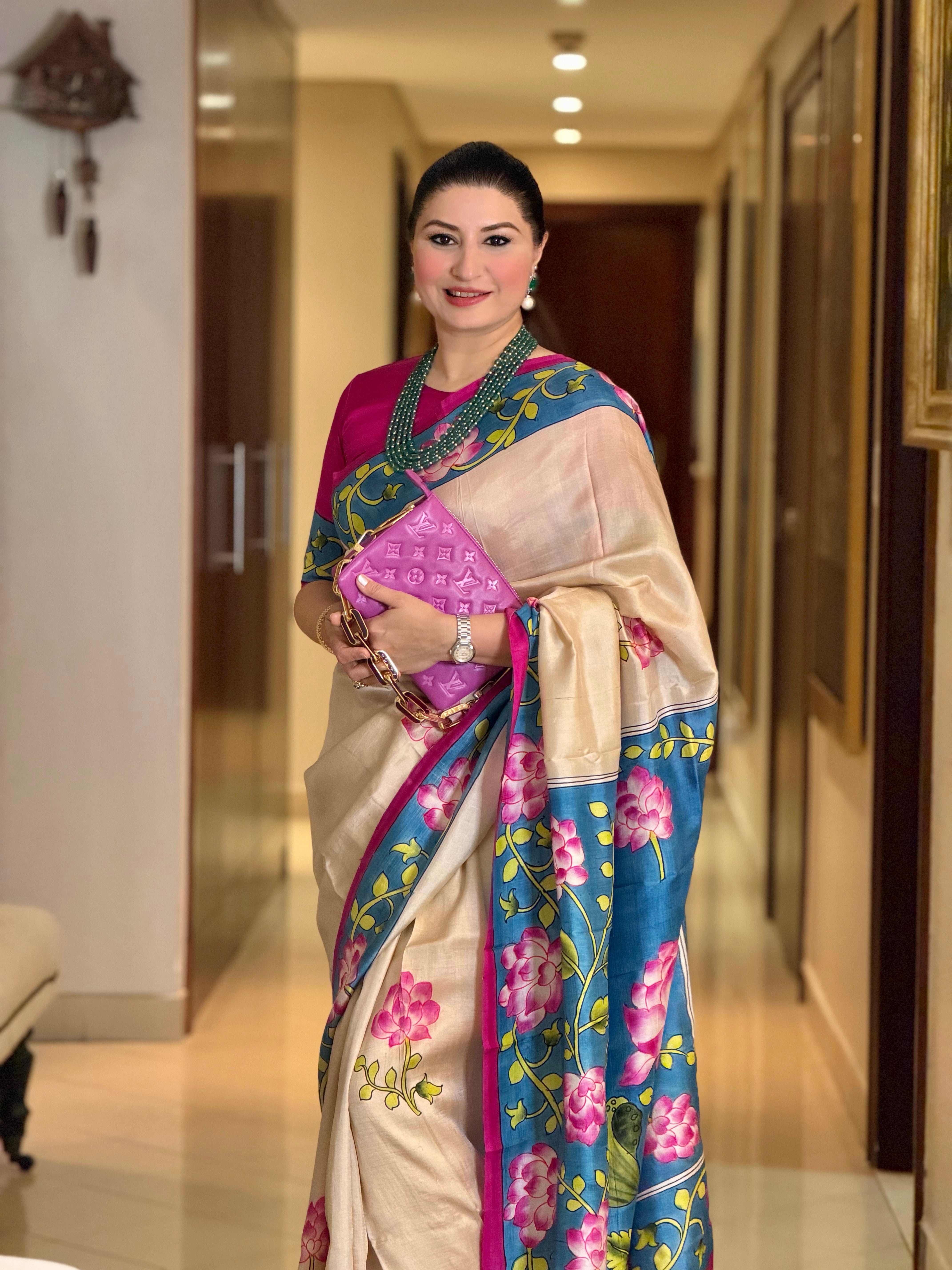 Elegant Kawaii Pichwai Saree in gold and blue with floral motifs for festive occasions