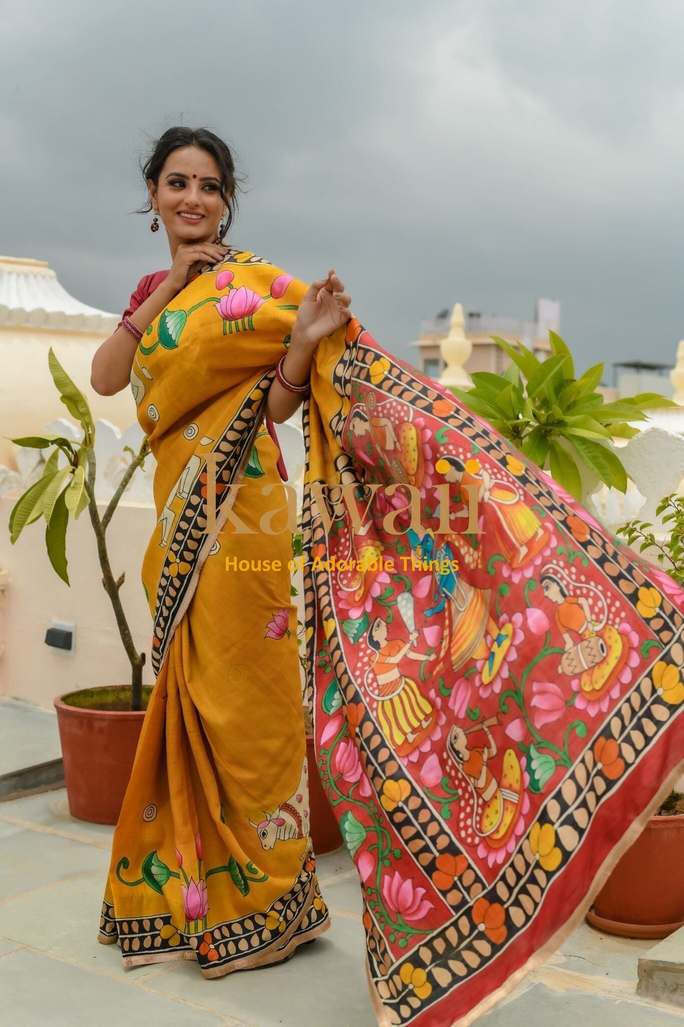 Kawaii pichwai saree in mustard yellow with detailed traditional art and floral designs worn by woman